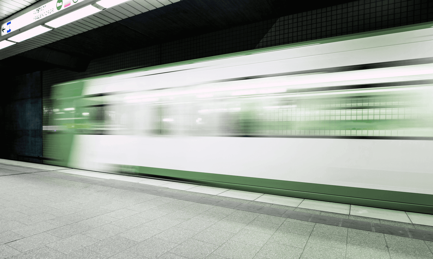 Comfrey coloured metro subway train with blur effect.