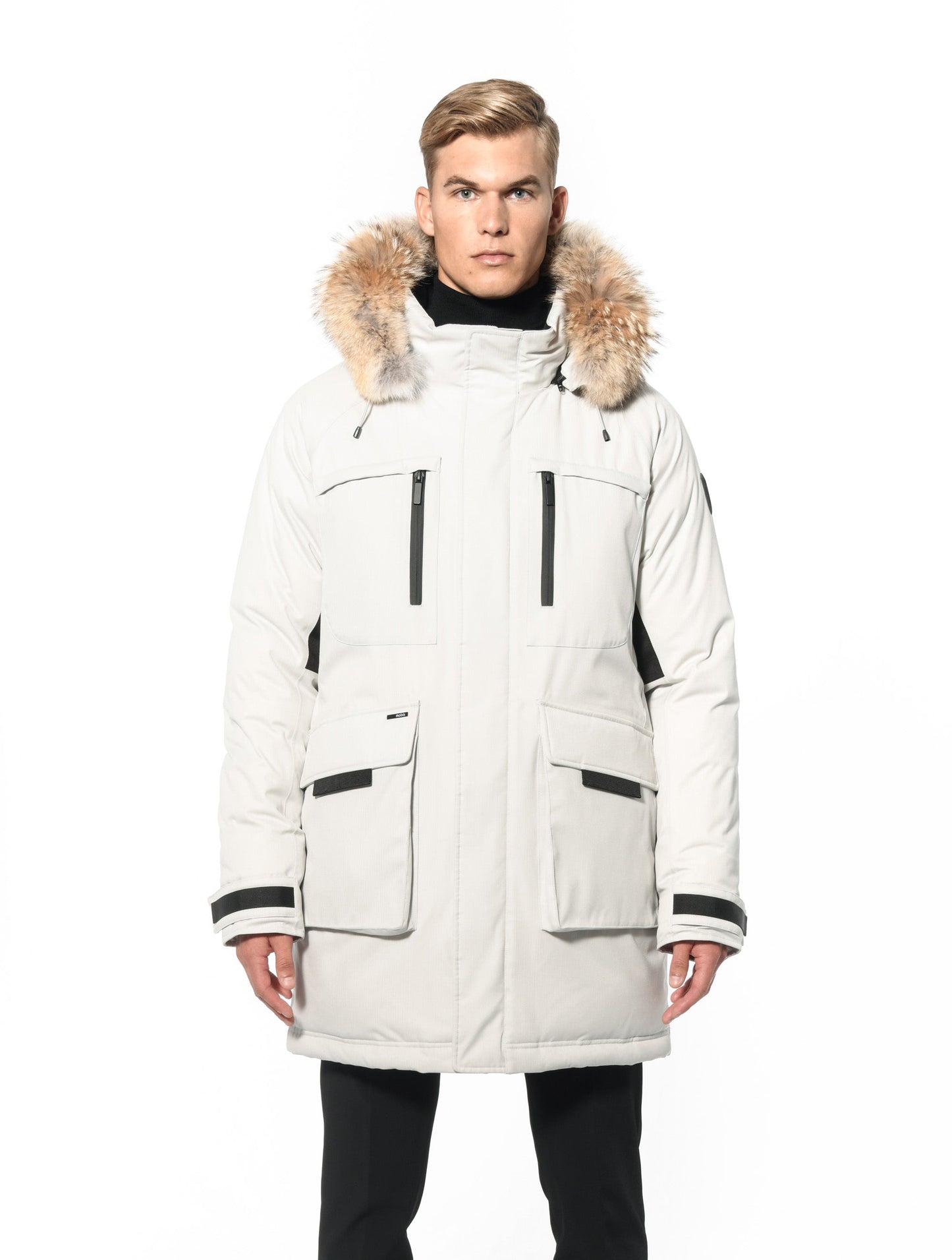 Men's thigh length down-filled parka with removable hood and removable coyote fur trim in Chalk