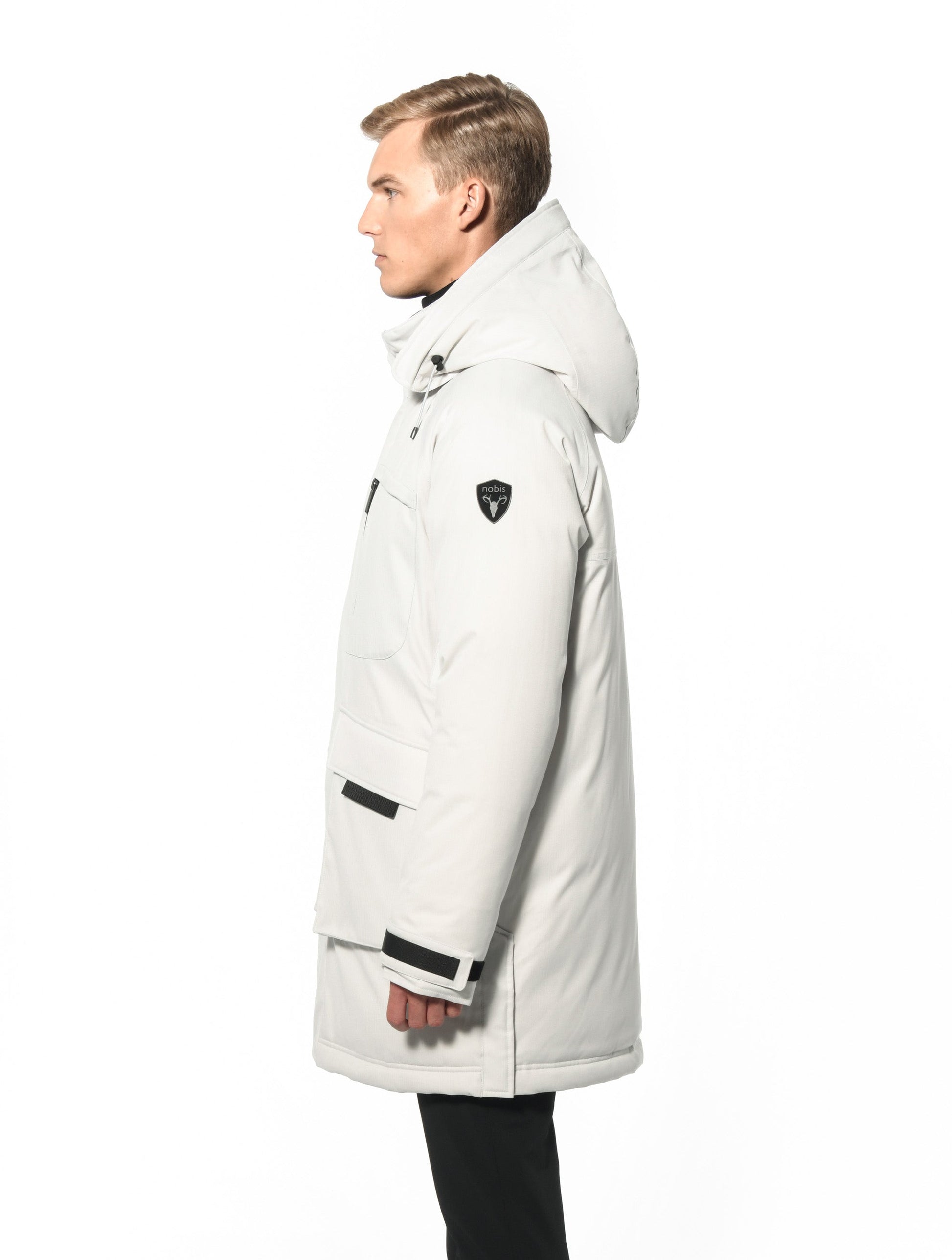 Men's thigh length down-filled parka with removable hood and removable coyote fur trim in Chalk