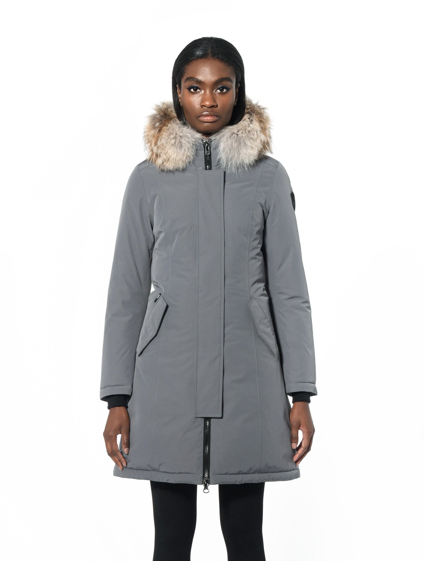 Ladies thigh length down-filled parka with non-removable hood and removable coyote fur trim in Concrete