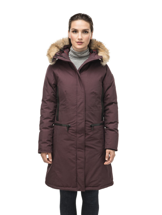 Knee length women's down filled parka with contrast ribbon accents and removable fur trim on the hood in Burgundy + Burgundy