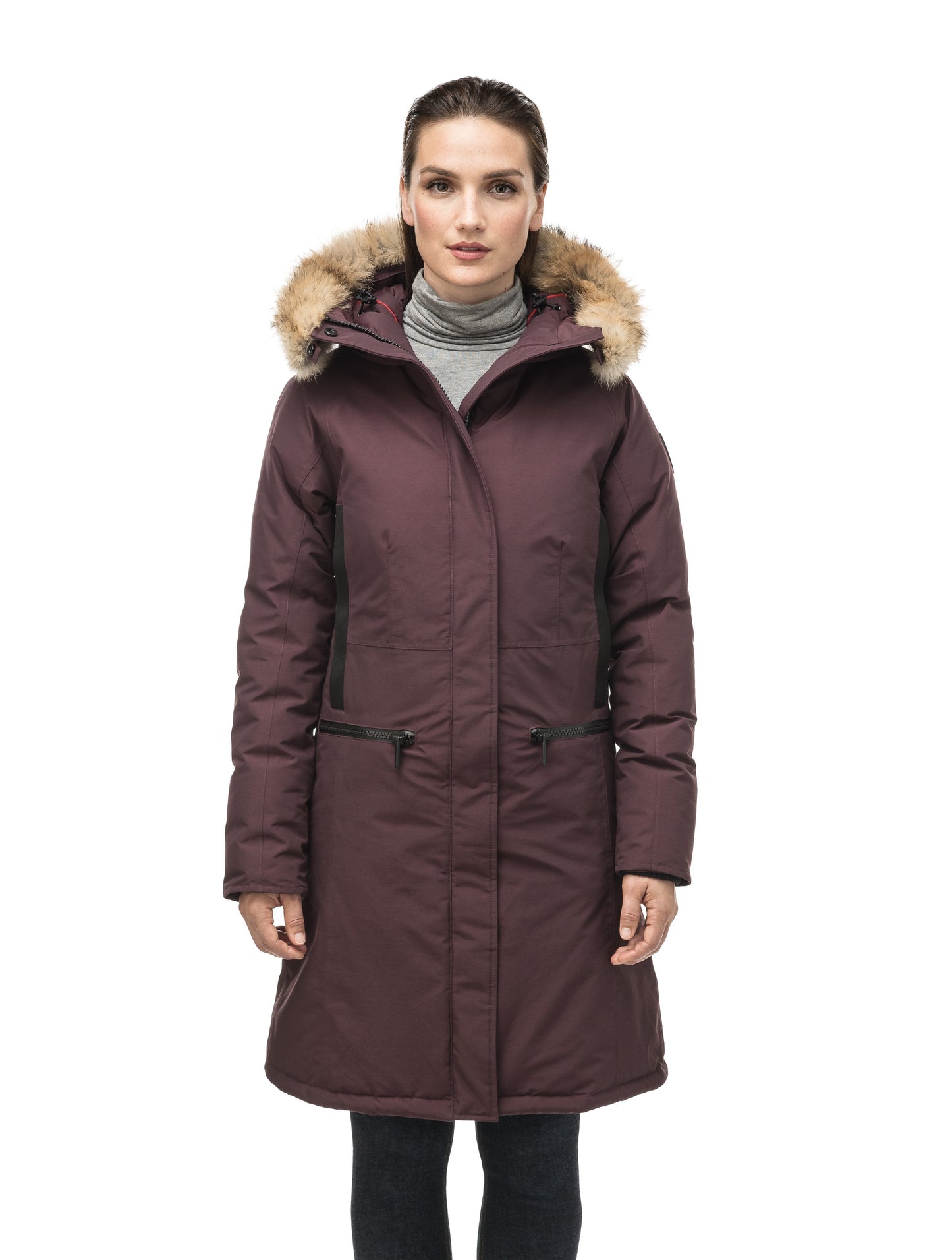 Knee length women's down filled parka with contrast ribbon accents and removable fur trim on the hood in Burgundy