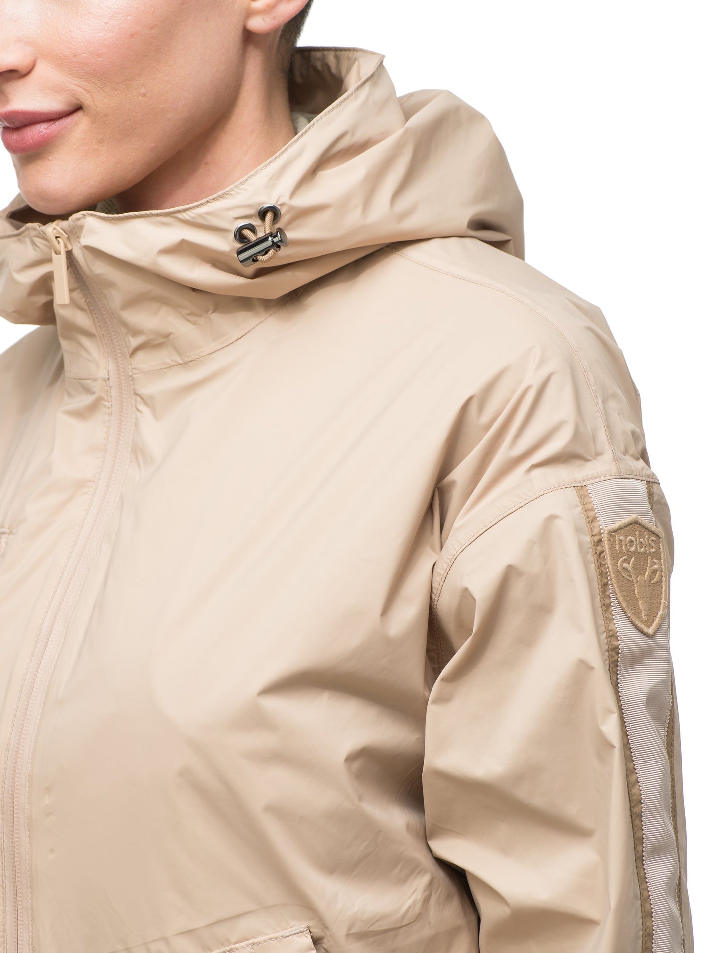 Women's waist length windbreaker with hood in Fawn