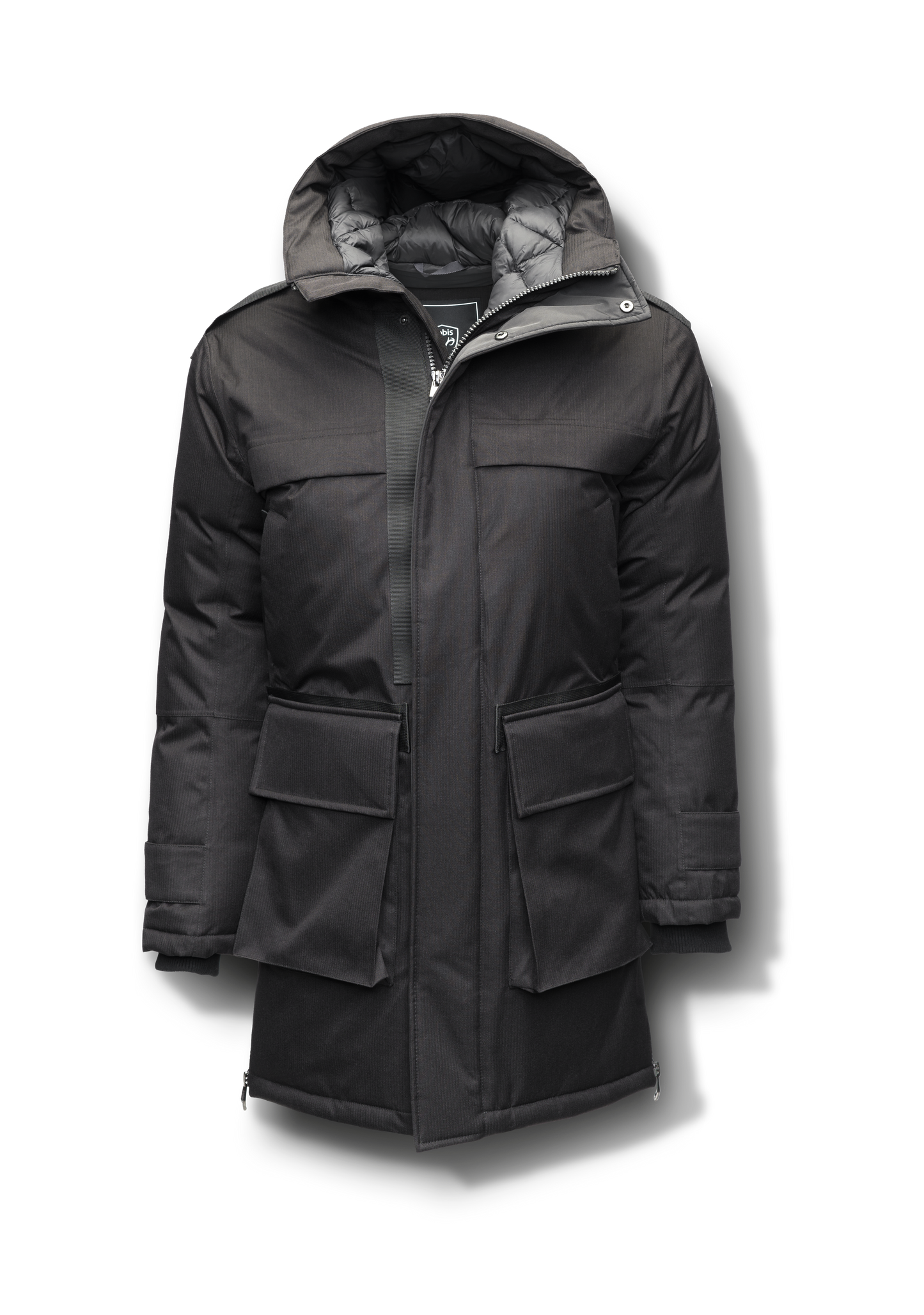 Alum Men's Long Parka in thigh length, Premium Canadian White Duck Down insulation, non-removable hood with removable coyote fur trim, two-way centre front zipper with magnetic closure wind flap, four exterior patch pockets at front, in Black