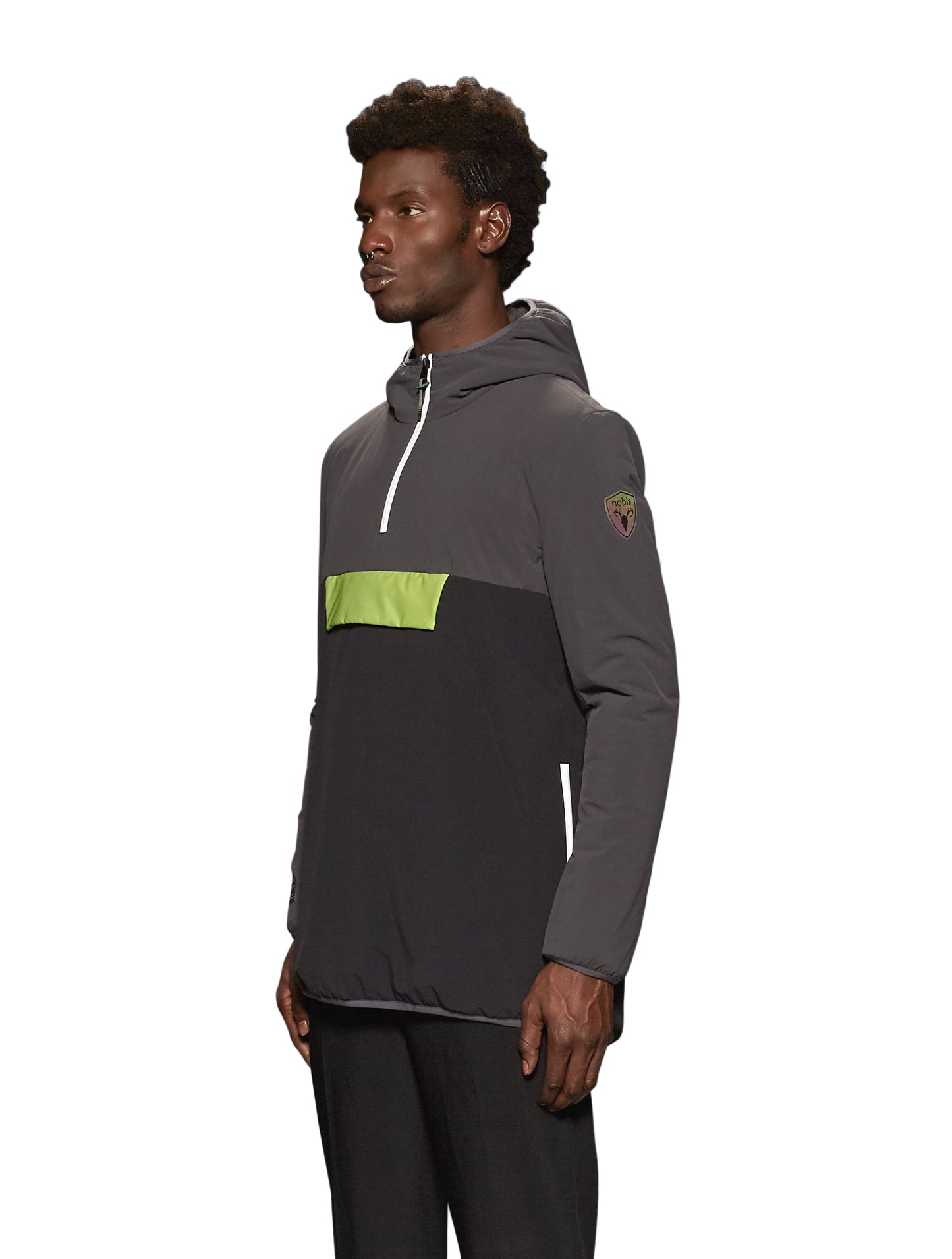 Unisex thigh length hooded anorak with vertical zipper along collar, side zippers along torso, and centre zipper pouch with a reflective flap, in Steel Grey/Black