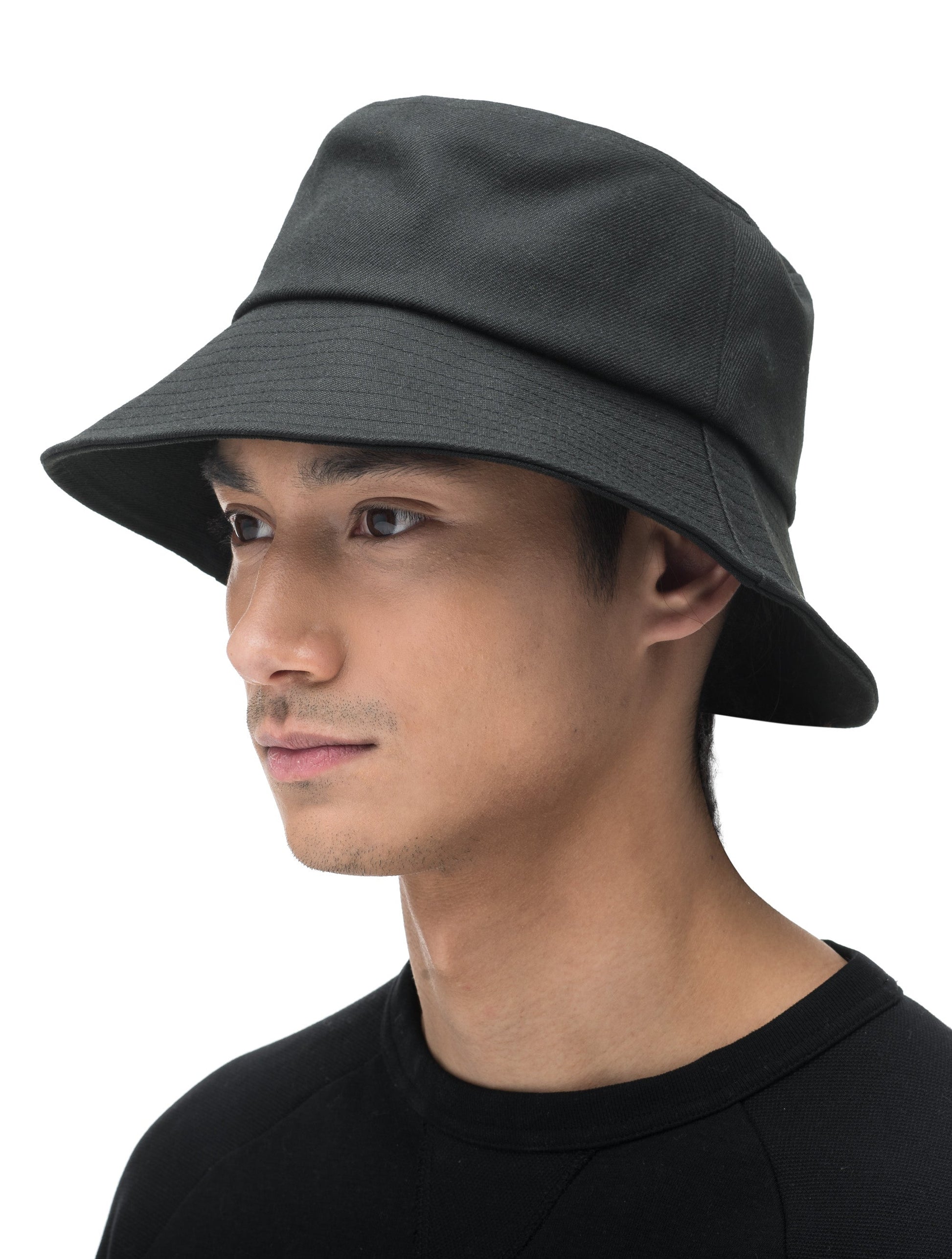 Unisex wide brim bucket hat with stitching detail on brim in Black