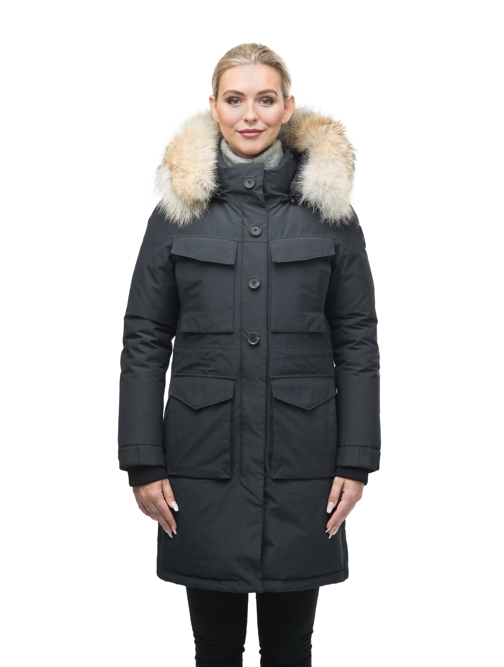 Women's knee length down filled parka with two chest patch pockets and two waist patch pockets in Black