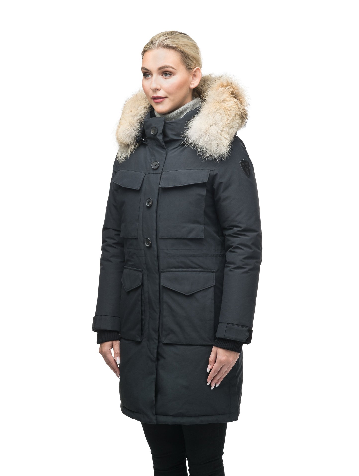 Women's knee length down filled parka with two chest patch pockets and two waist patch pockets in Black