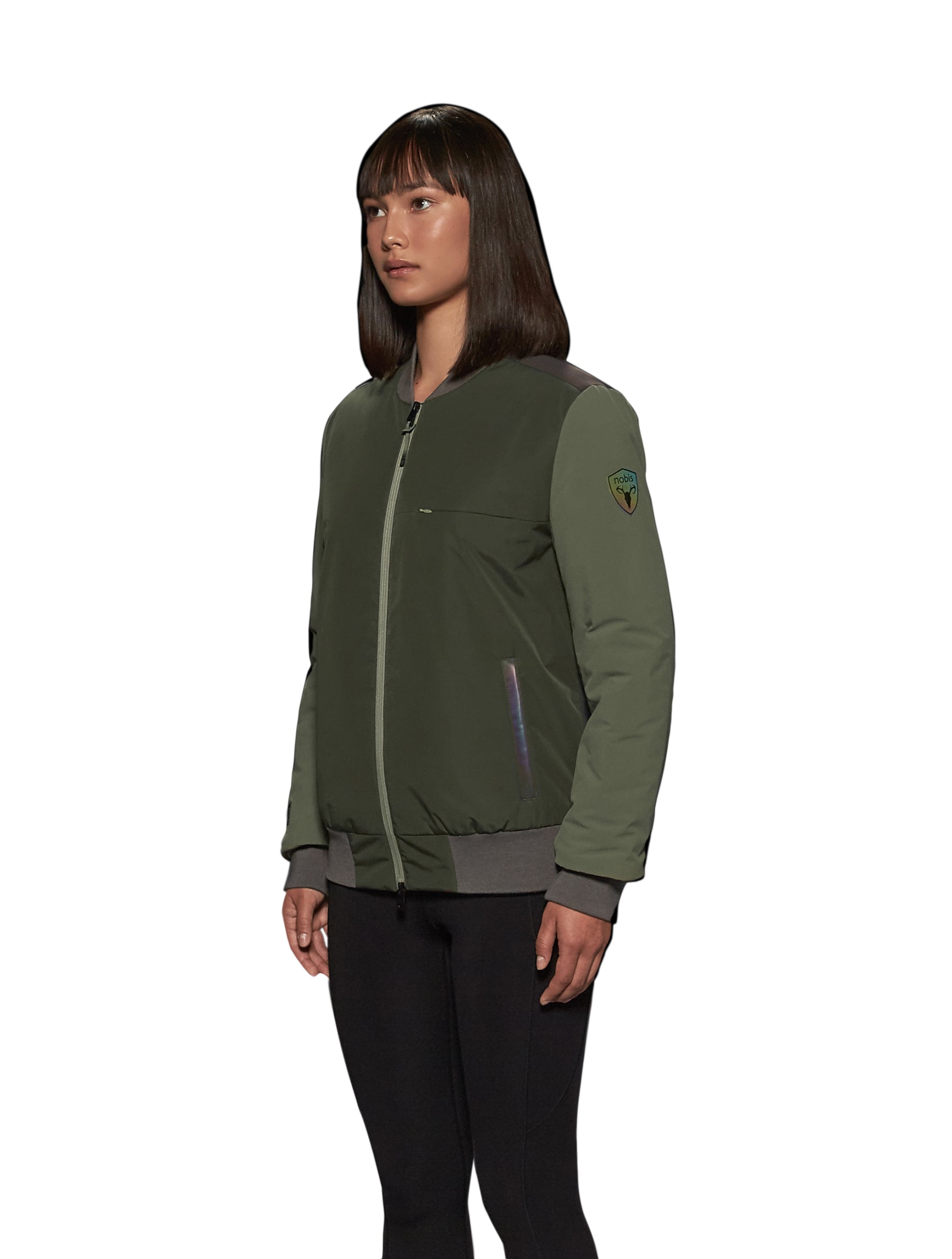 Unisex hip length bomber jacket with a contrast colour back panel, and zipper pockets at waist and an invisible zipper pocket at chest, in Dusty Olive/Licorice