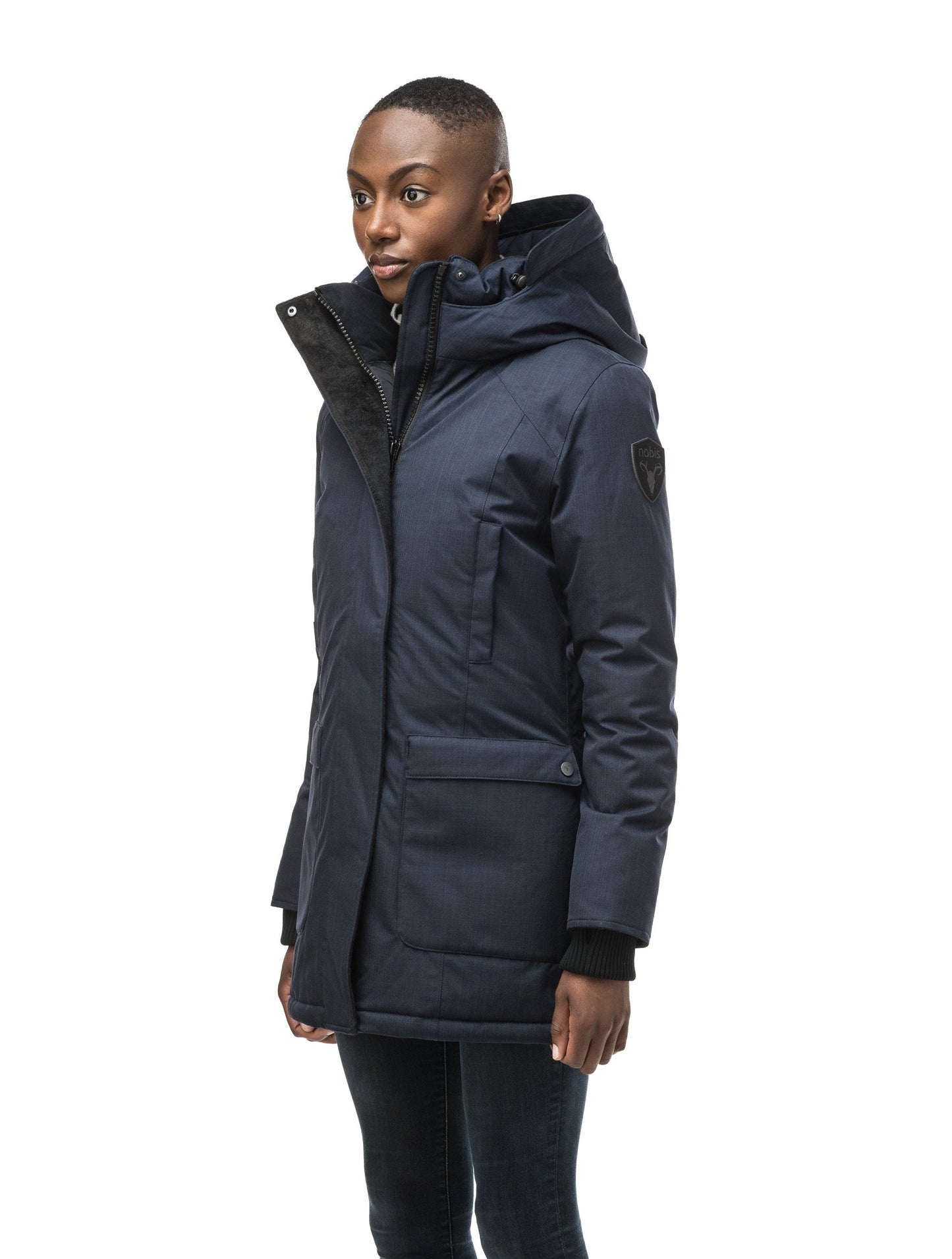 Women's down filled parka that sits just below the hip with a clean look and two hip patch pockets in CH Navy