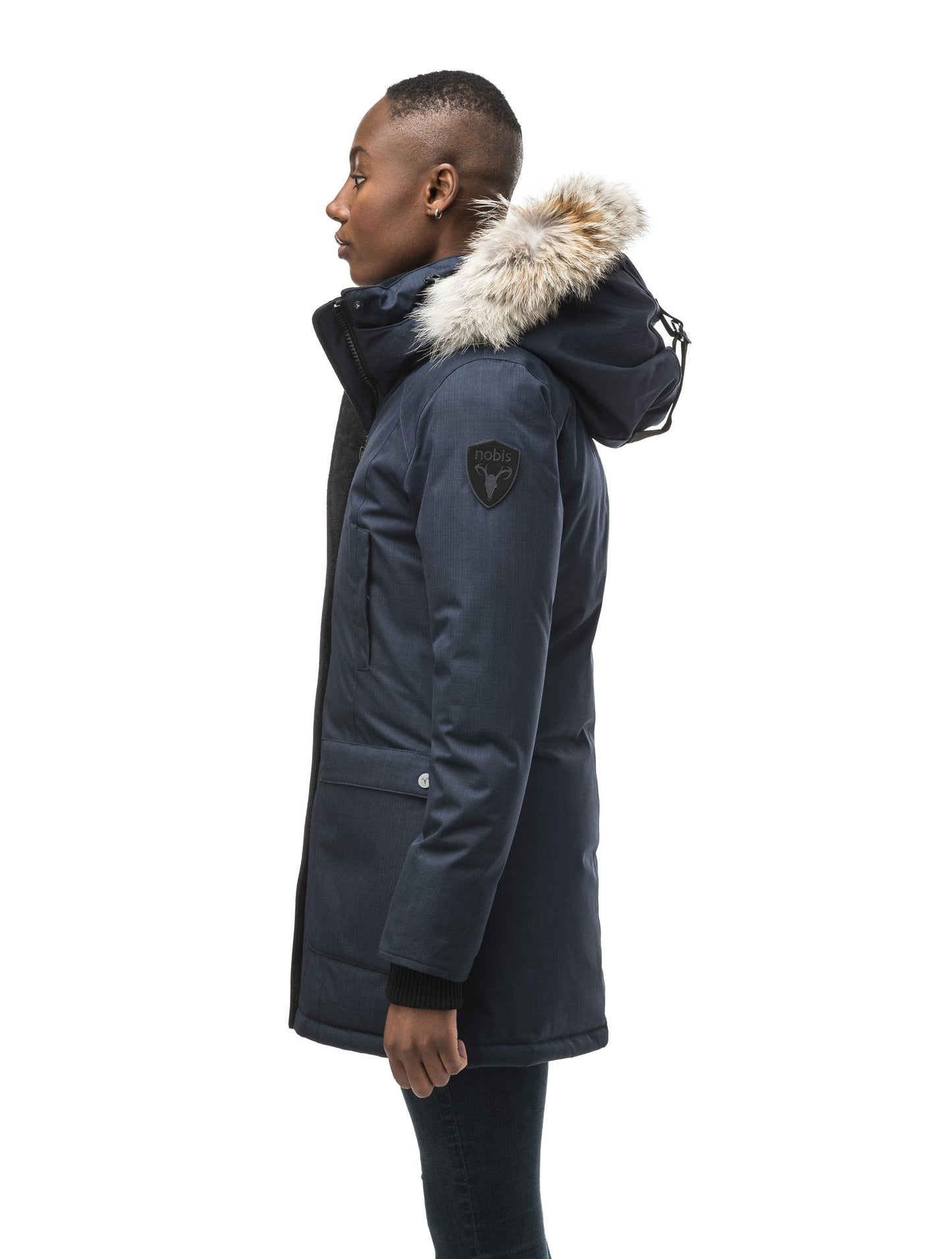 Women's down filled parka that sits just below the hip with a clean look and two hip patch pockets in CH Navy