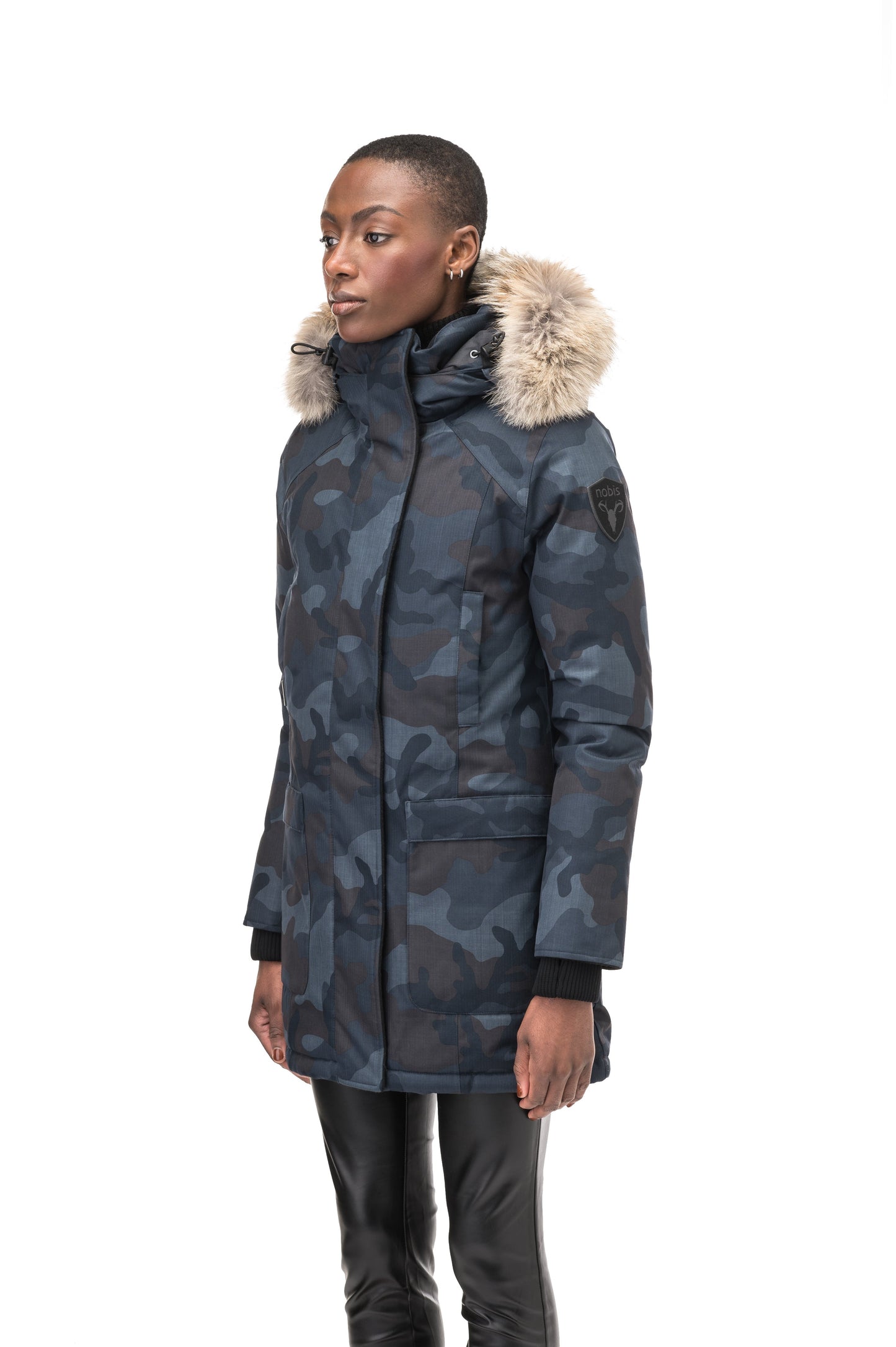 Women's down filled parka that sits just below the hip with a clean look and two hip patch pockets in Navy Camo