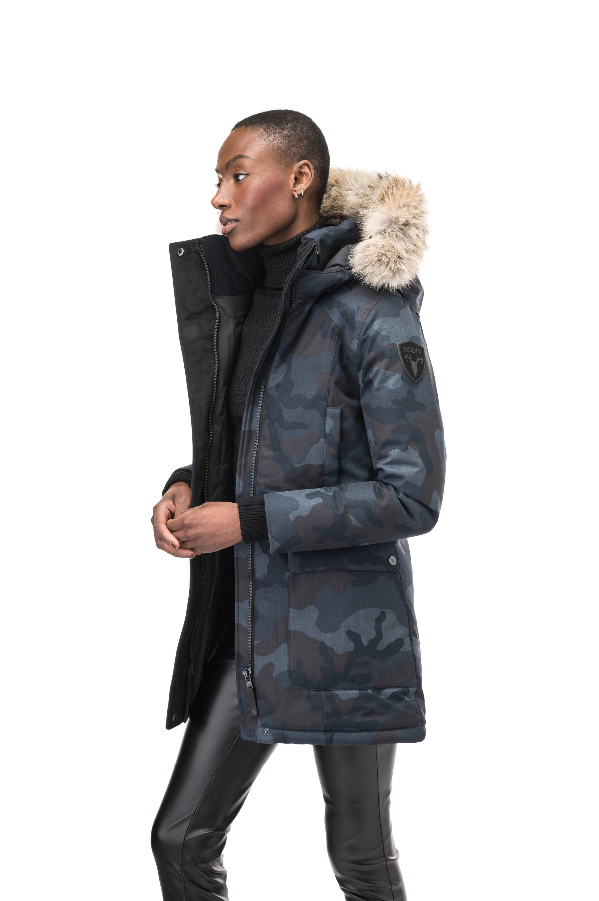 Women's down filled parka that sits just below the hip with a clean look and two hip patch pockets in Navy Camo