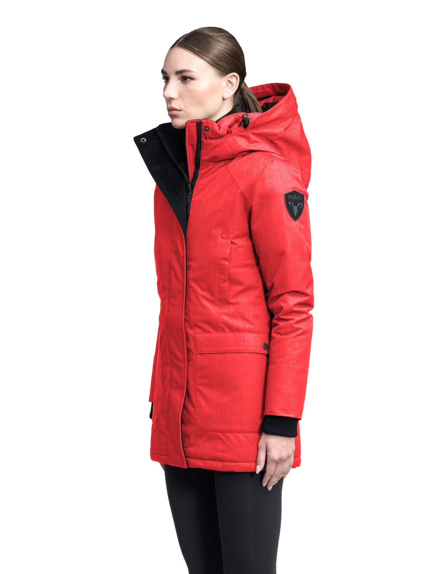 Women's down filled parka that sits just below the hip with a clean look and two hip patch pockets in BlackCarla Furless Ladies Parka in thigh length with Canadian Premium White Duck Down insulation, non-removable hood, centre-front zipper with magnetic closure wind flap, and four exterior pockets, in Vermillion