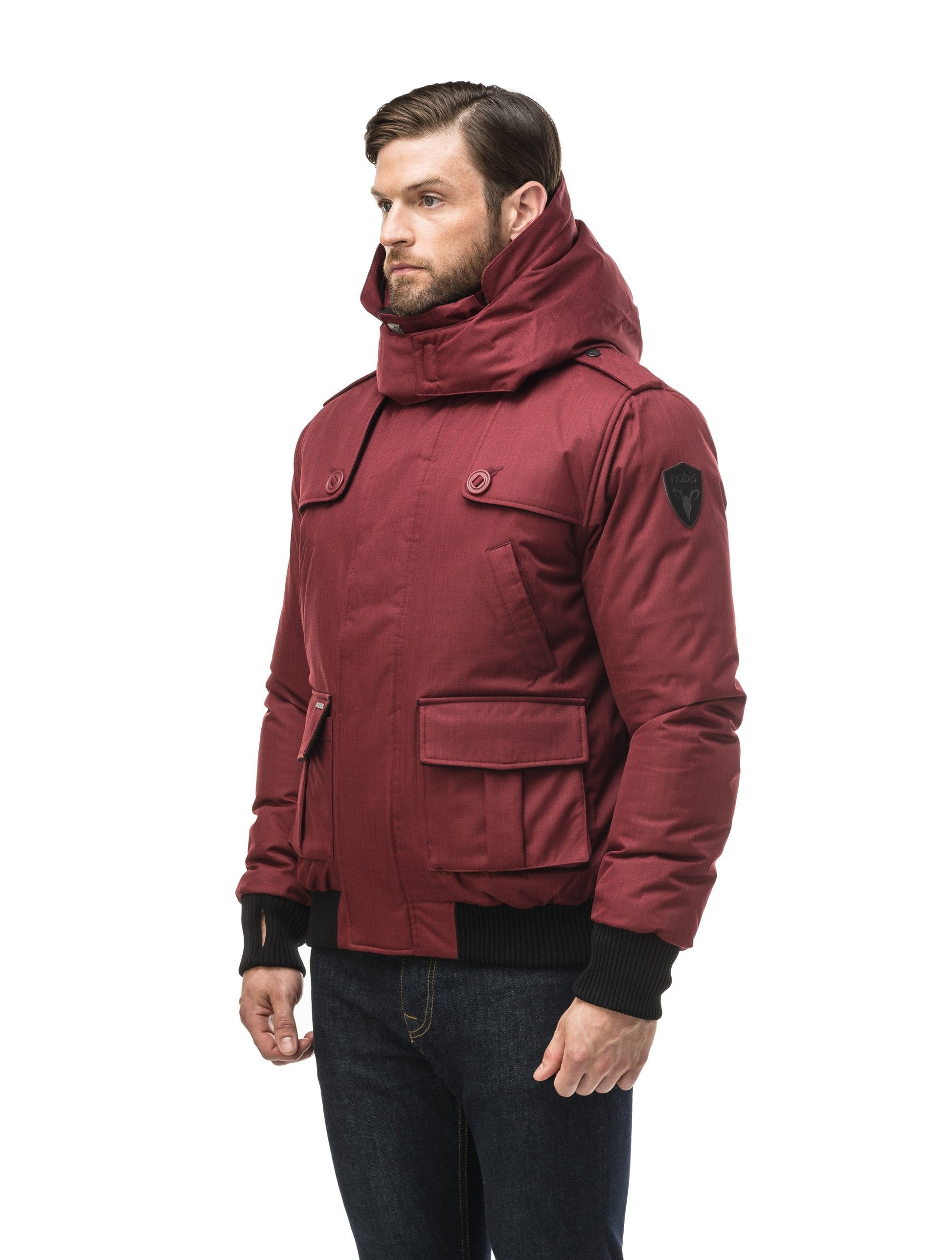 Men's down filled bomber that sits just above the hips with a completely removable hood that's windproof, waterproof, and breathable in CH Cabernet