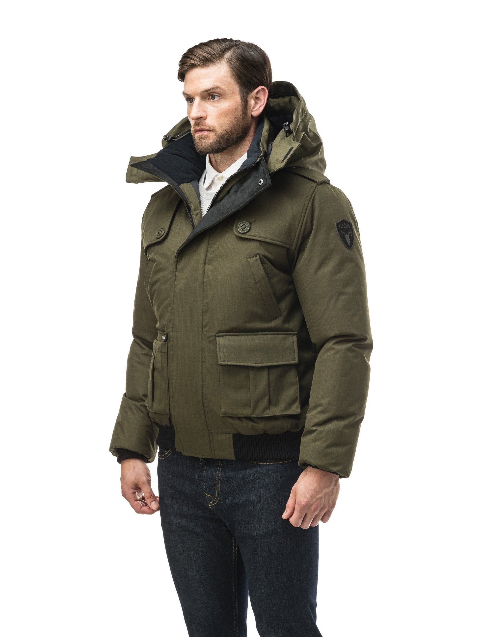 Men's down filled bomber that sits just above the hips with a completely removable hood that's windproof, waterproof, and breathable in CH Fatigue