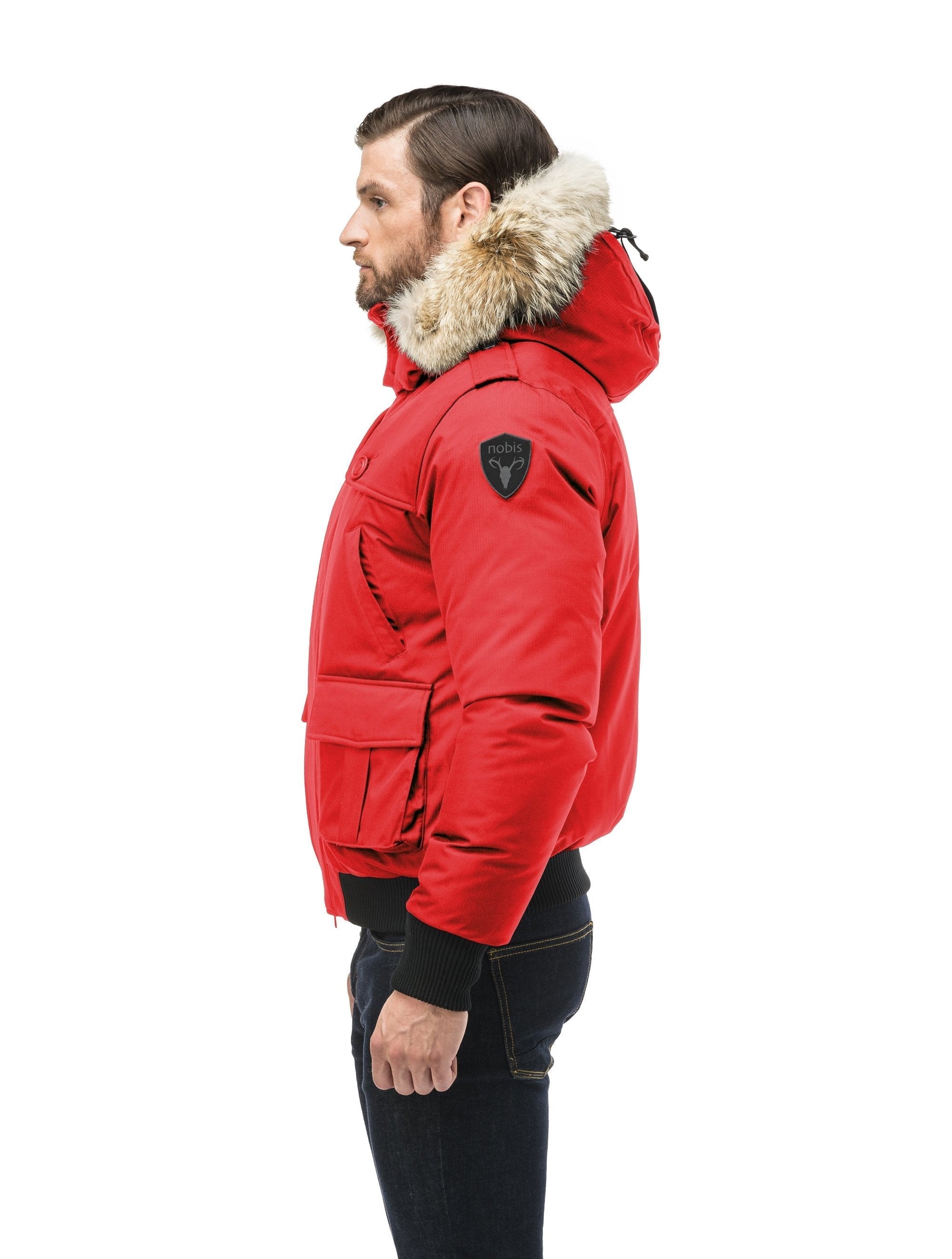 Men's down filled bomber that sits just above the hips with a completely removable hood that's windproof, waterproof, and breathable in CH Red