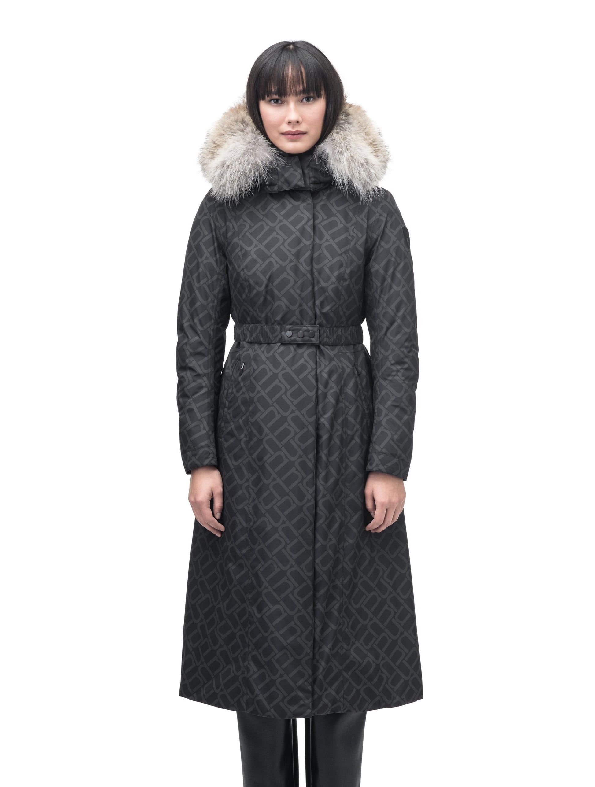 Celest Ladies Duster Parka in knee length, Canadian duck down insulation, removable hood and coyote fur trim, with adjustable belt, in Dark Monogram