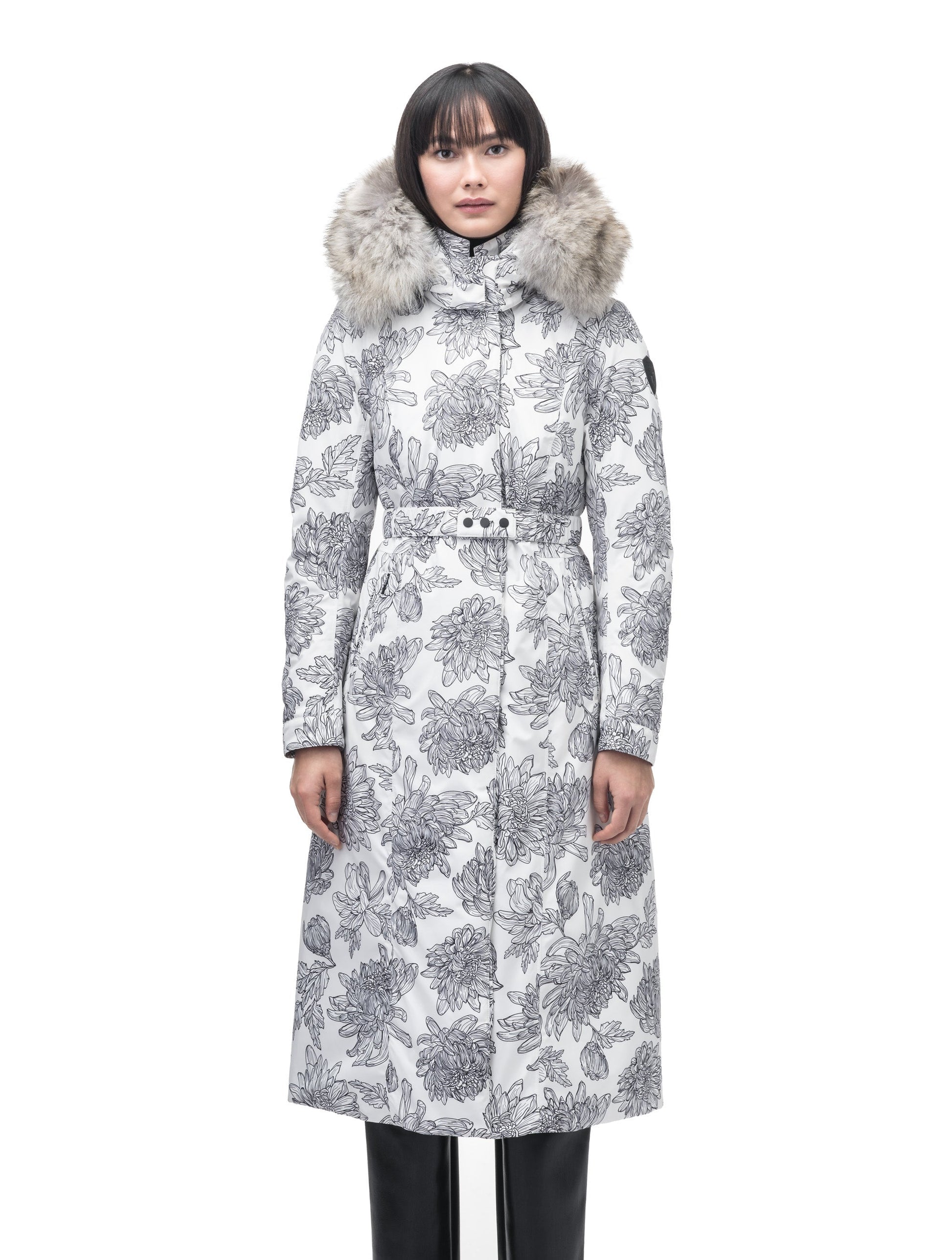 Celest Ladies Duster Parka in knee length, Canadian duck down insulation, removable hood and coyote fur trim, with adjustable belt, in White Floral