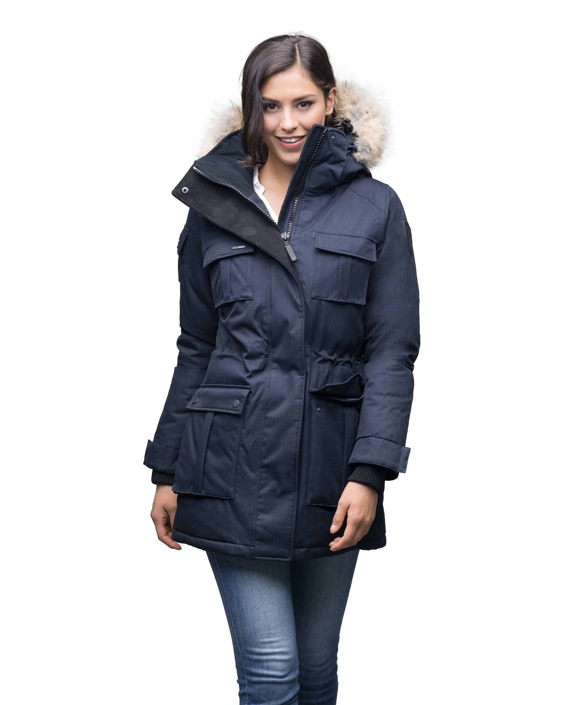 Women's down filled thigh length parka with four pleated patch pockets and an adjustable waist in CH Navy