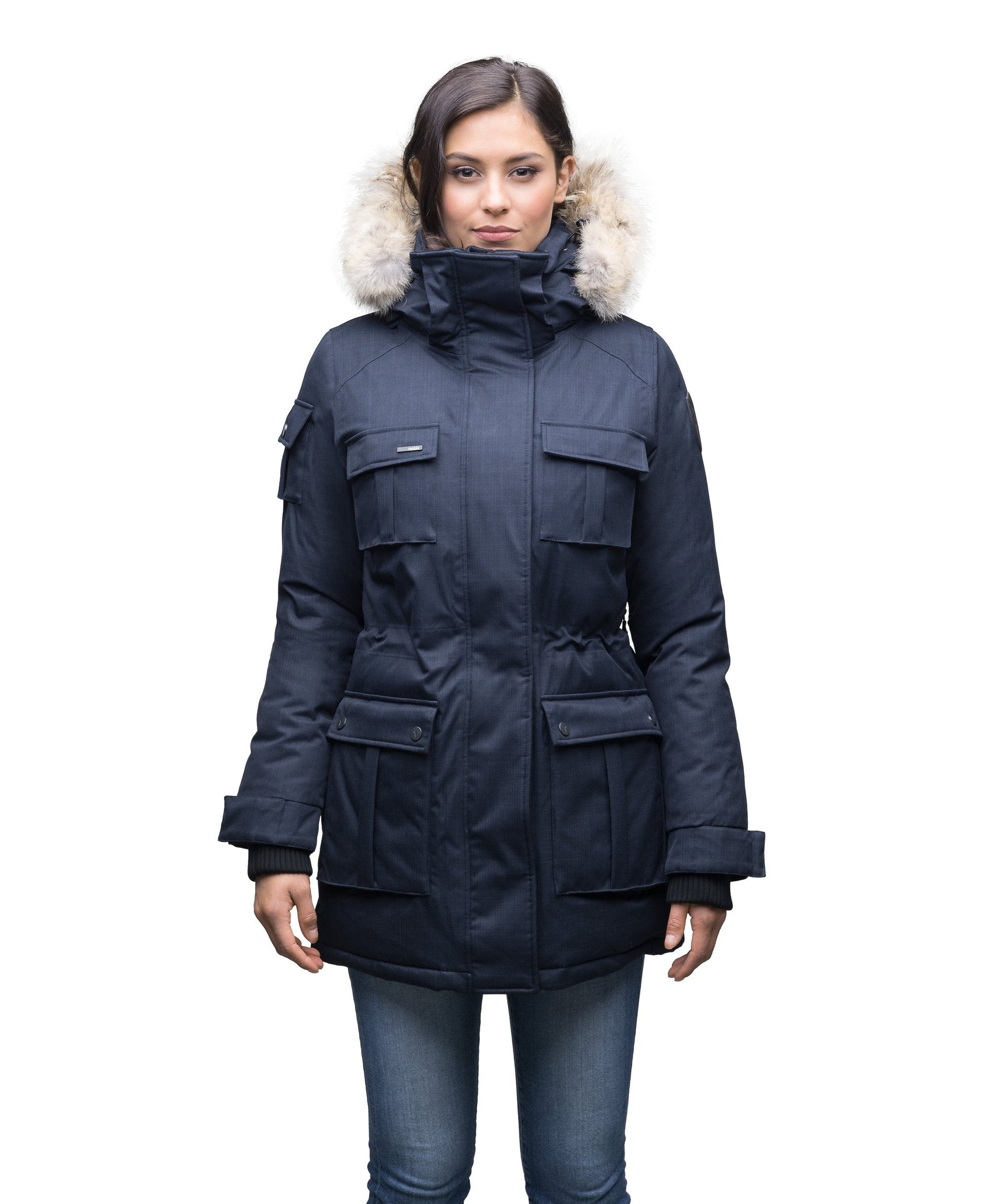 Women's down filled thigh length parka with four pleated patch pockets and an adjustable waist in CH Navy