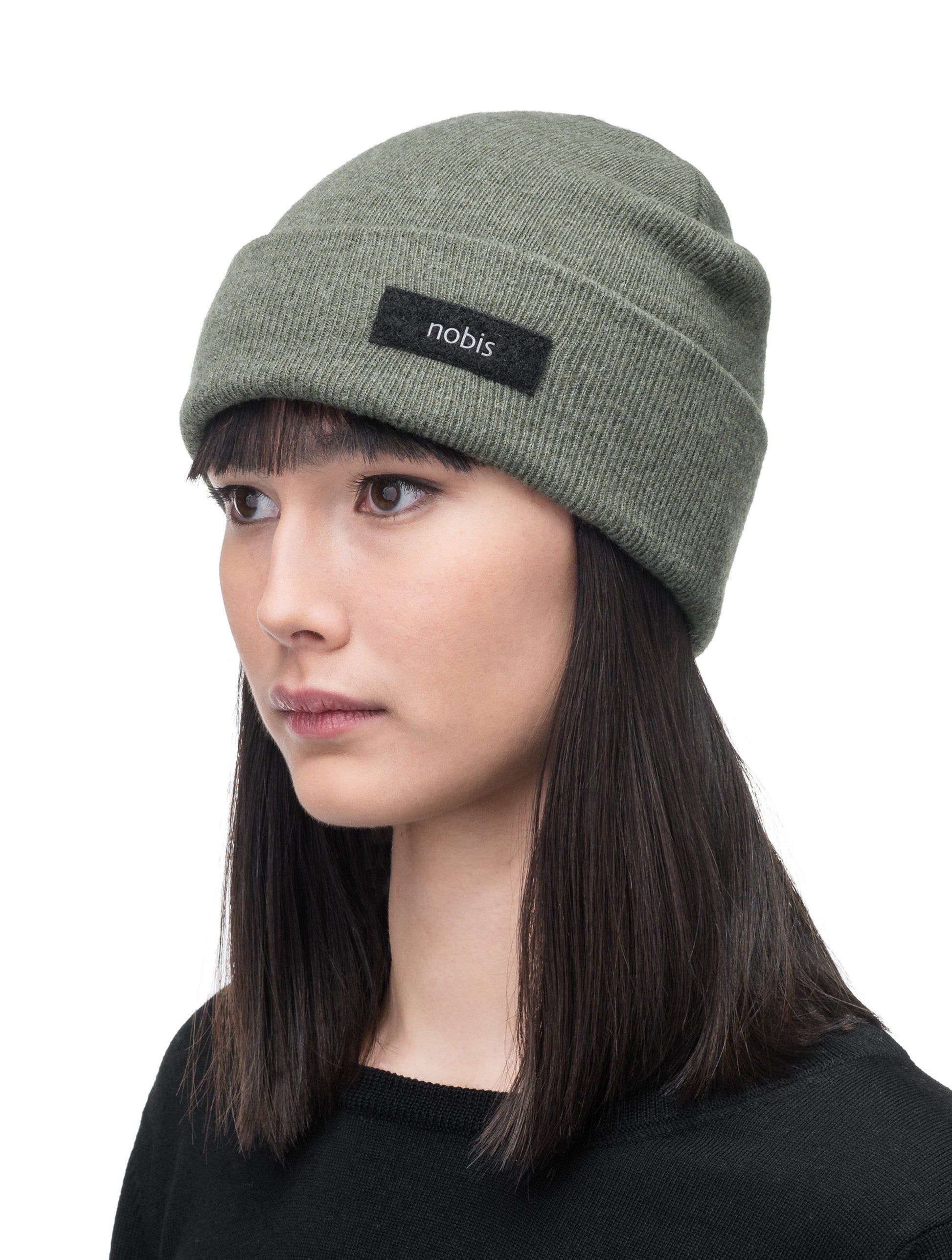 Dalia Unisex Jersey Knit Beanie in extrafine merino wool, and nobis label on cuff, in Evergreen