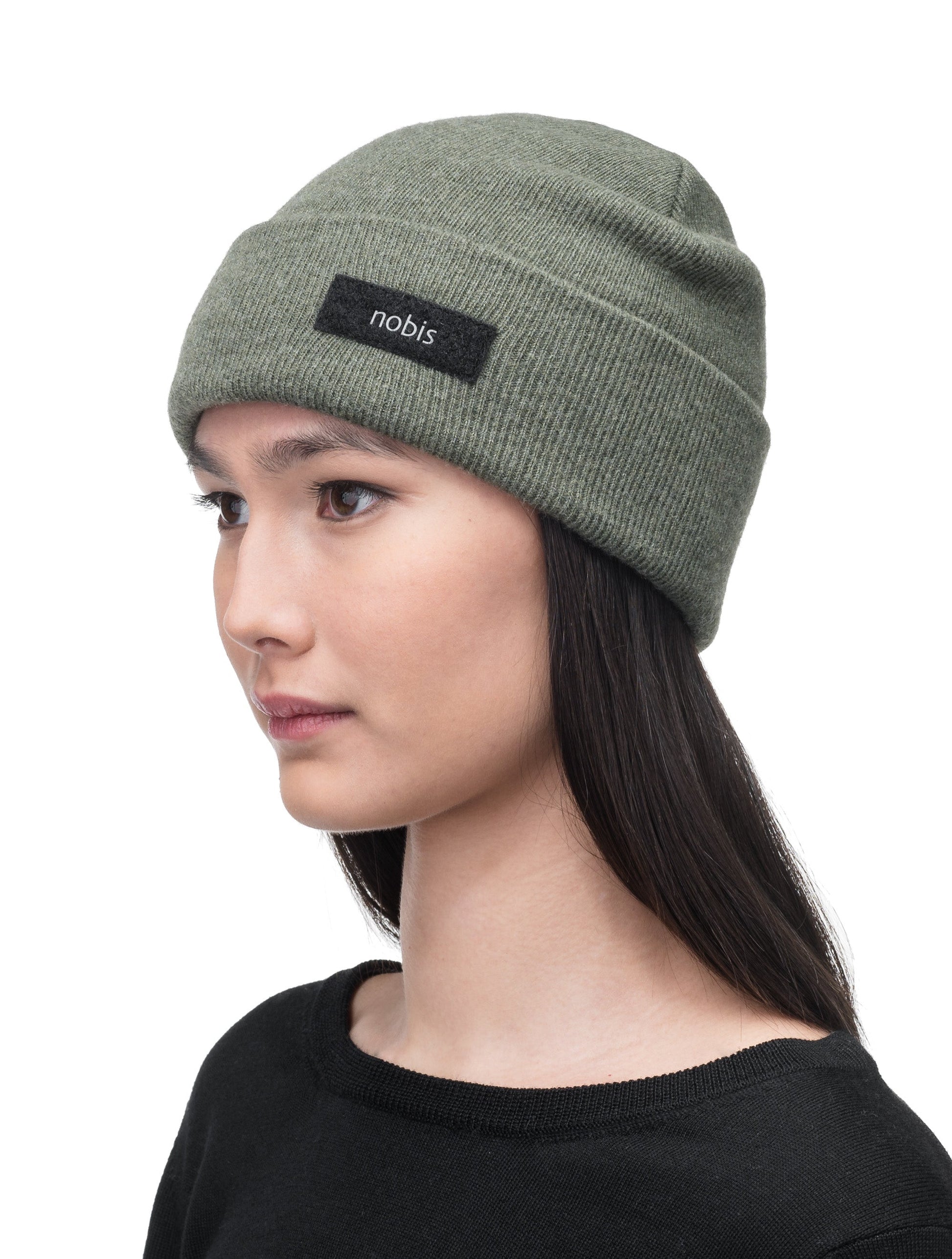 Dalia Unisex Jersey Knit Beanie in extrafine merino wool, and nobis label on cuff, in Evergreen