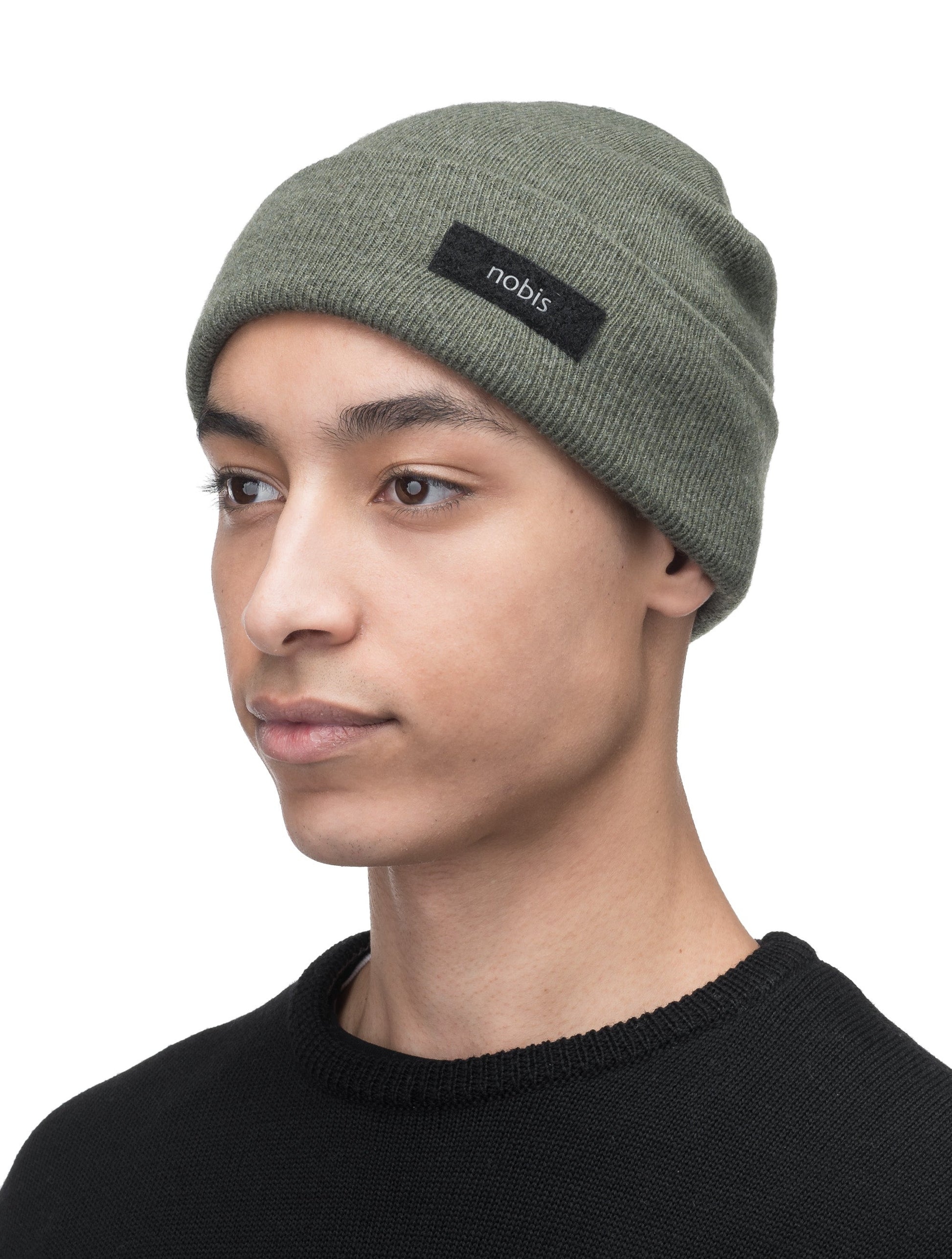 Dalia Unisex Jersey Knit Beanie in extrafine merino wool, and nobis label on cuff, in Evergreen