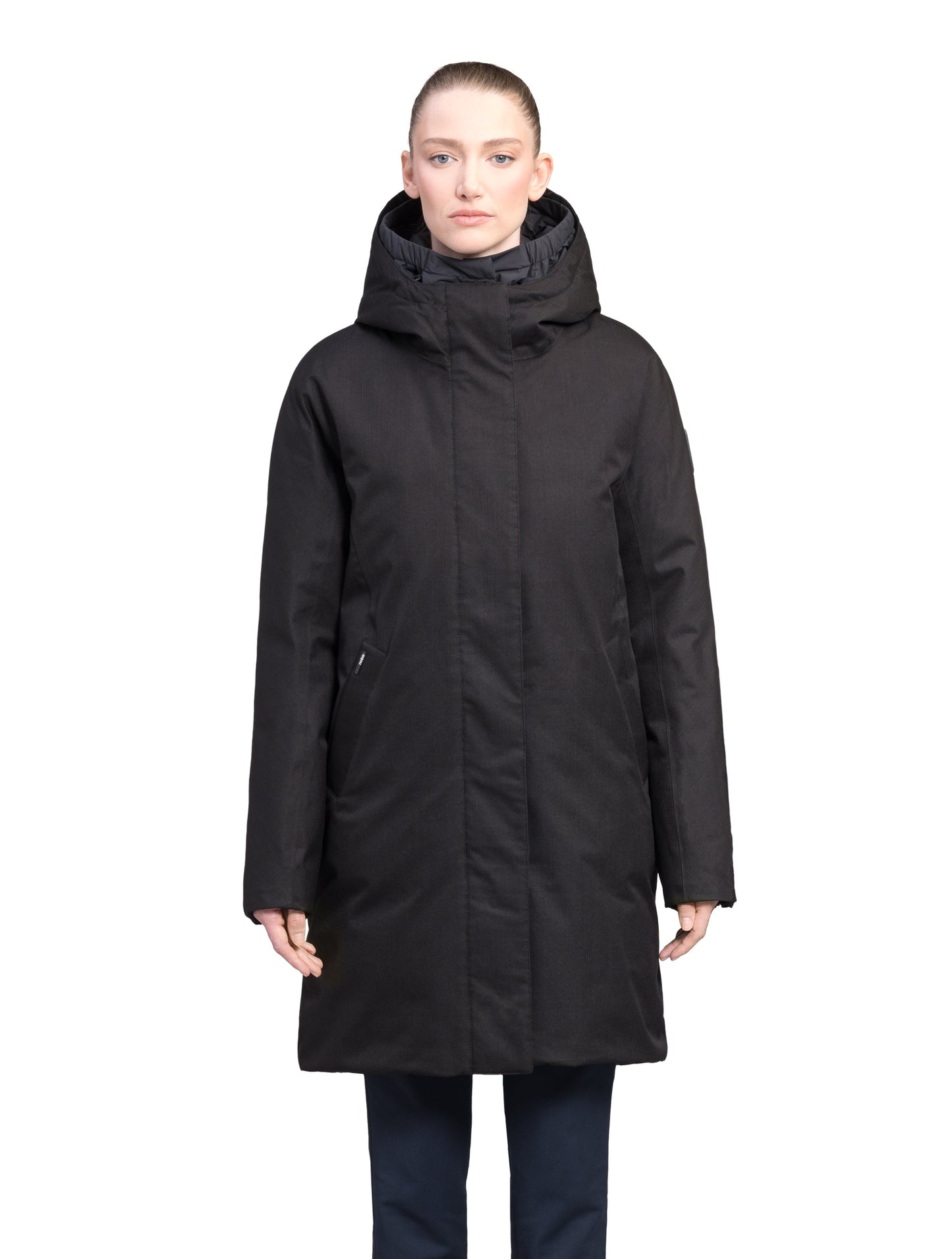 Dory Women's Tailored Back Zip Parka in knee length, premium Crosshatch fabrication, Premium Canadian White Duck Down insulation, non-removable down-filled hood, removable interior hood, centre front two-way zipper with wind flap, vertical zipper detailing along back, in Black