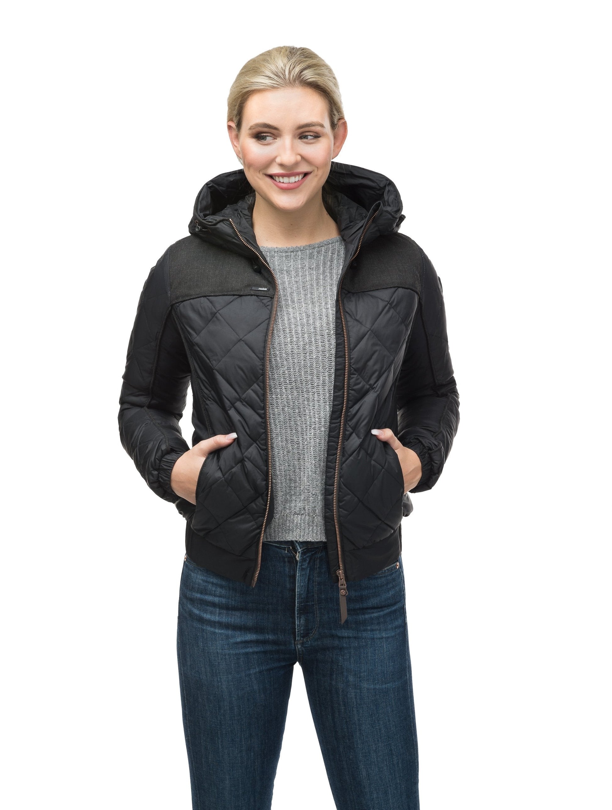 Lightweight women's jacket with hood and quilted pattern featuring a contrasting upper fabric in Black