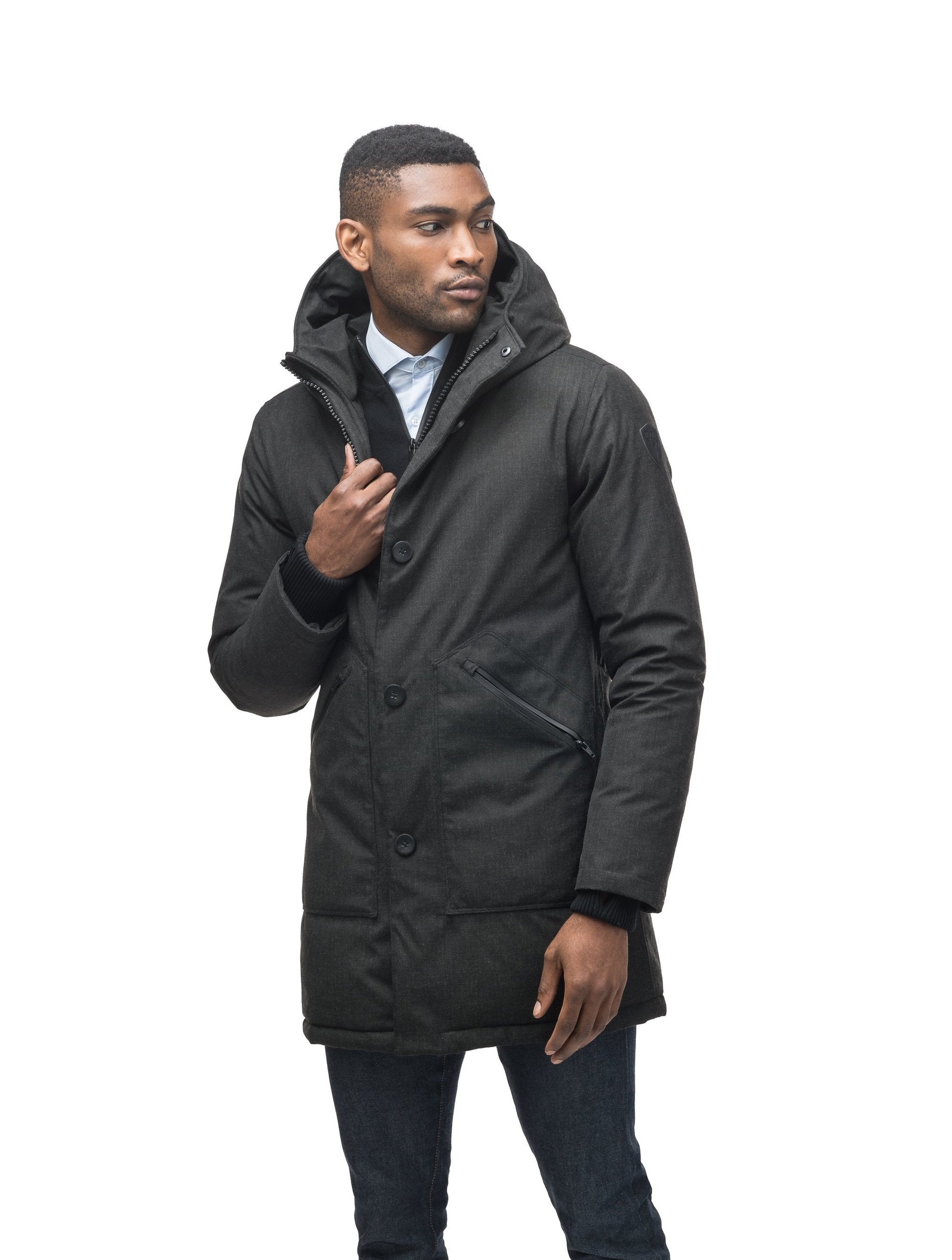 Men's fur free hooded parka with zipper and button closure placket featuring two oversized front pockets in H. Black