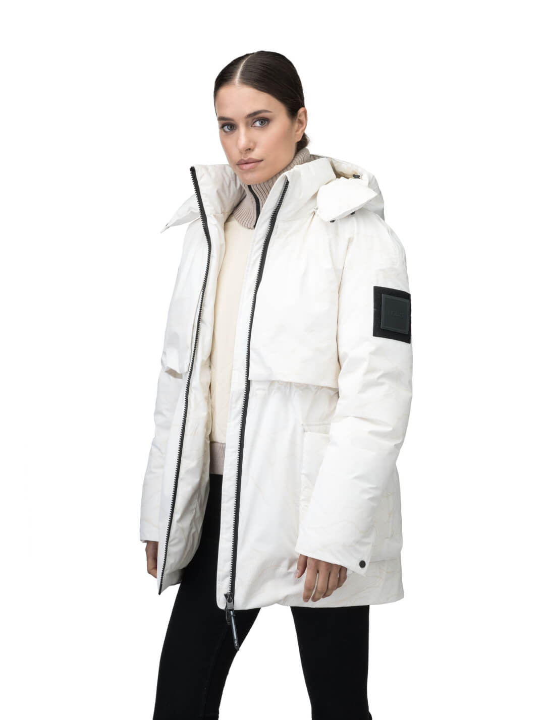 Haelyn Ladies Short Utility Parka in thigh length, 3-Ply Micro Denier fabrication, Premium Canadian White Duck Down insulation, removable down-filled hood, two-way centre front zipper, hidden adjustable cord at waist, adjustable snap cuffs, and four exterior patch pockets at front, in Wheat Desert