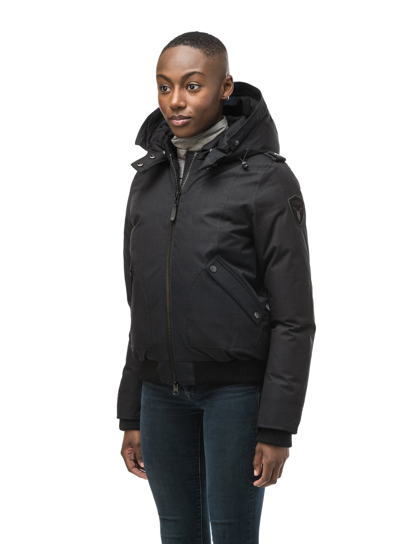 Women's bomber style down filled jacket with a removable hood and fur trim in CH Black