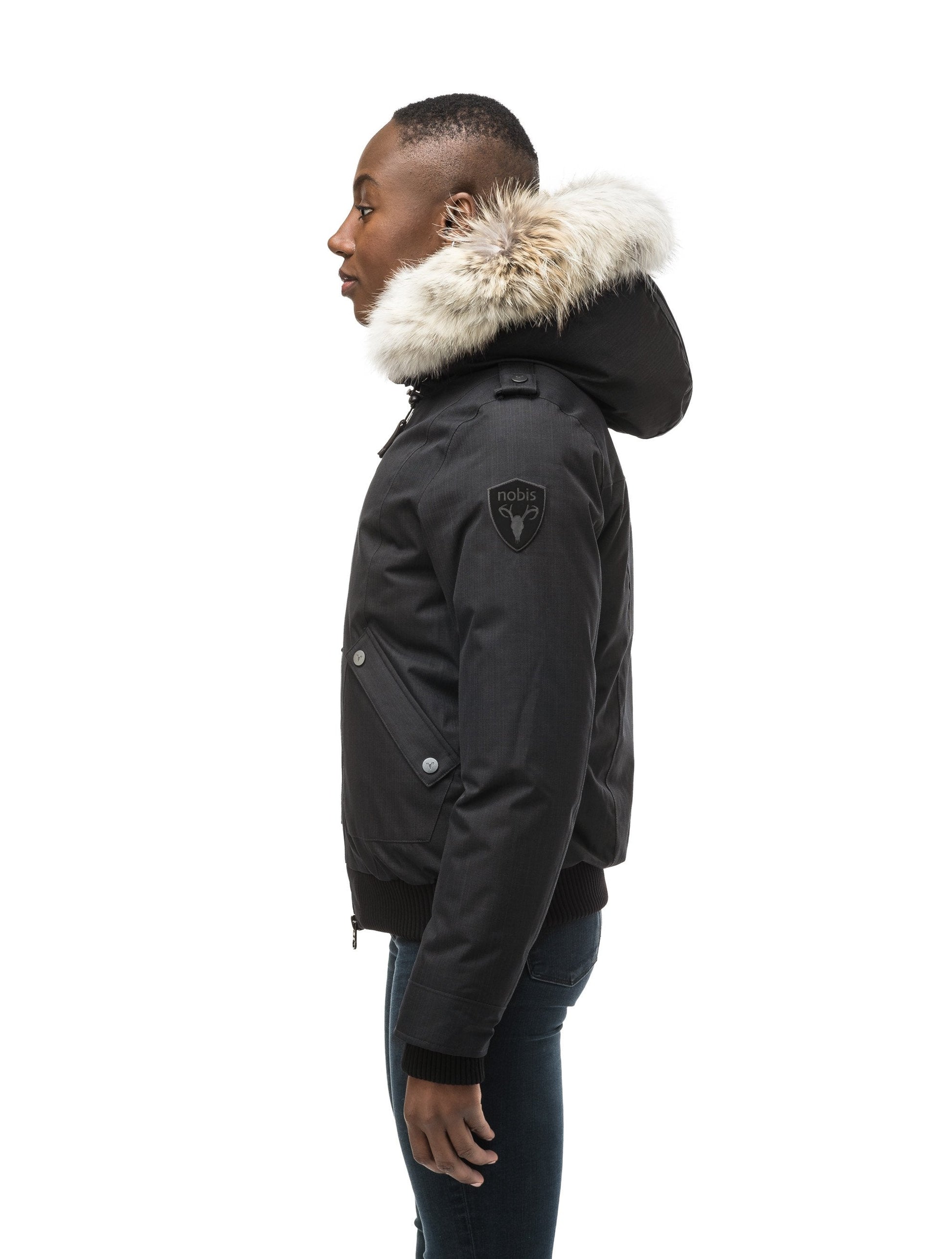 Women's bomber style down filled jacket with a removable hood and fur trim in CH Black