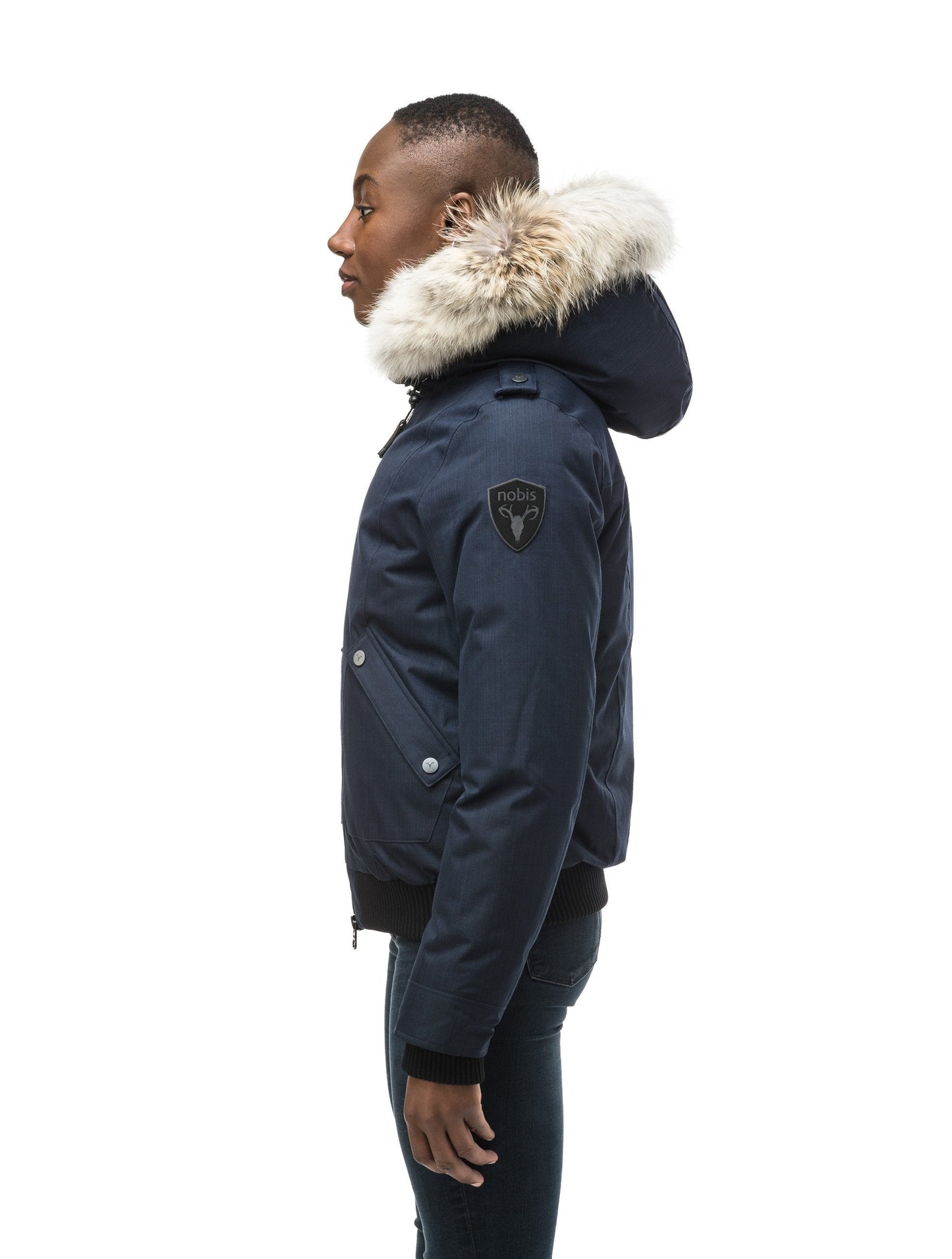 Women's bomber style down filled jacket with a removable hood and fur trim in CH Navy