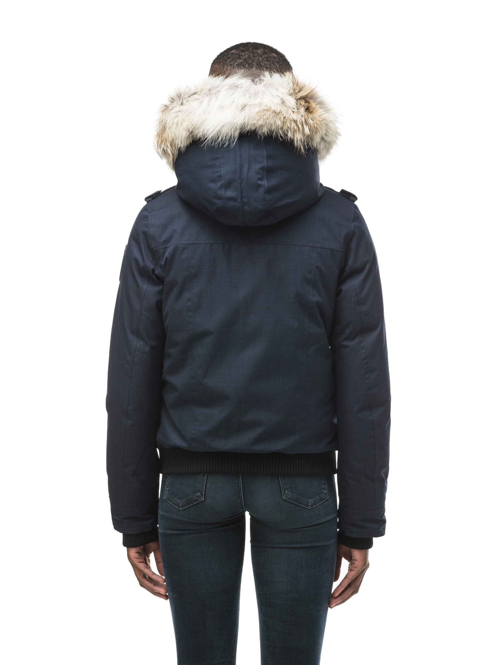 Women's bomber style down filled jacket with a removable hood and fur trim in CH Navy