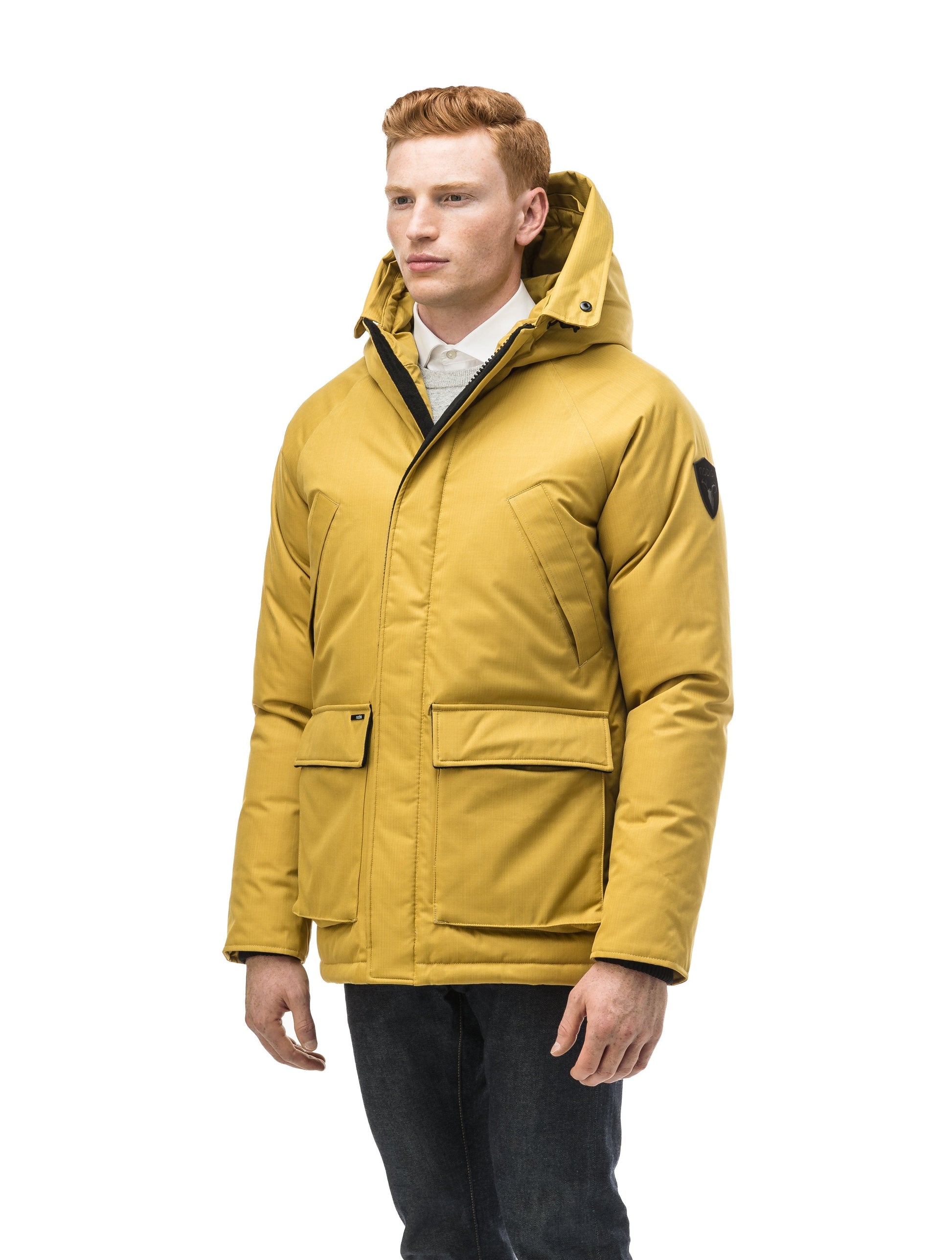 Men's waist length down filled jacket with two front pockets with magnetic closure and a removable fur trim on the hood in CH Yellow