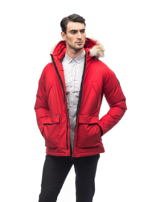 Men's waist length down filled jacket with two front pockets with magnetic closure and a removable fur trim on the hood in CH Red + CH Red