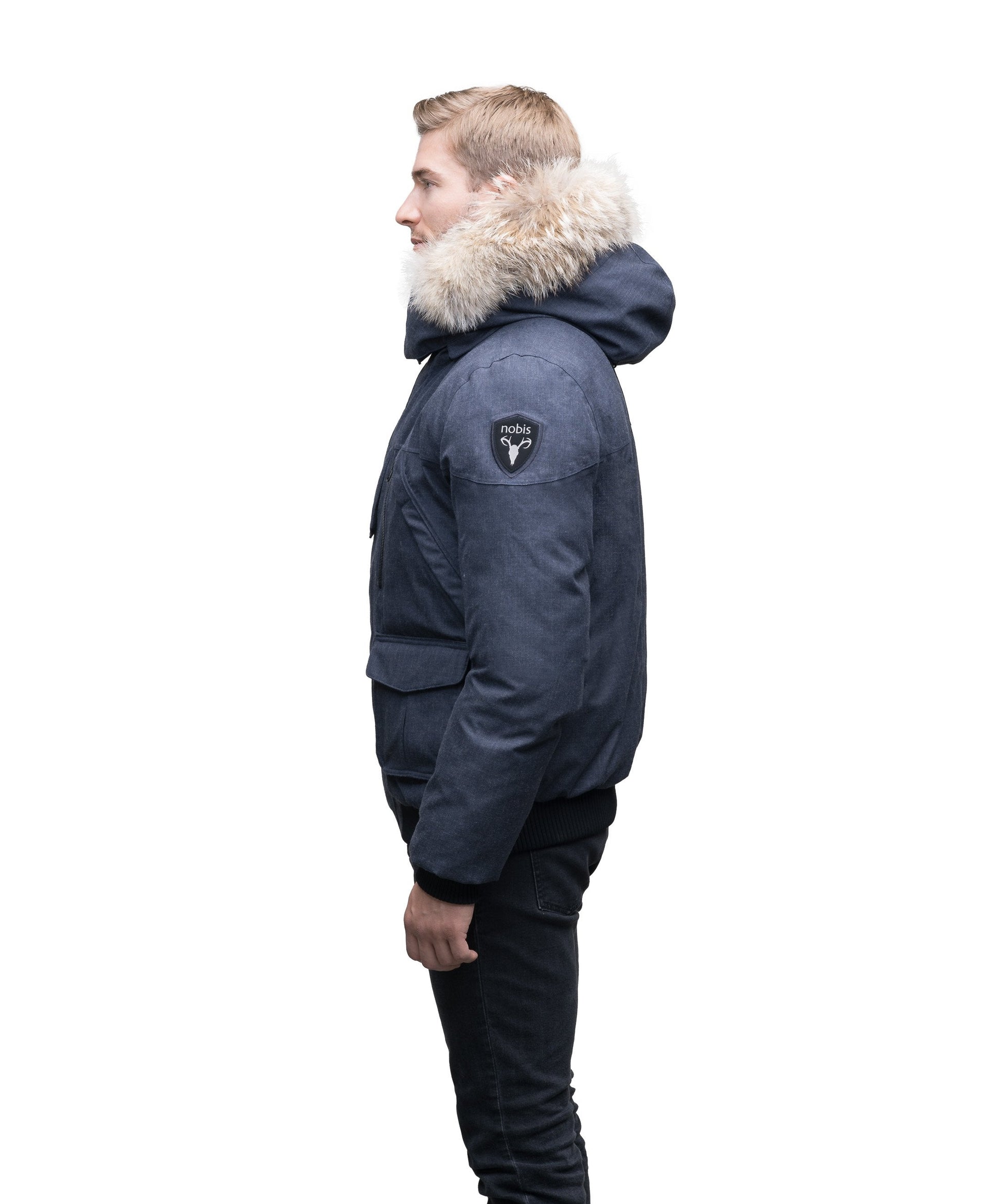 Men's classic down bomber with two patch pockets and a right shoulder storm flap in H. Navy