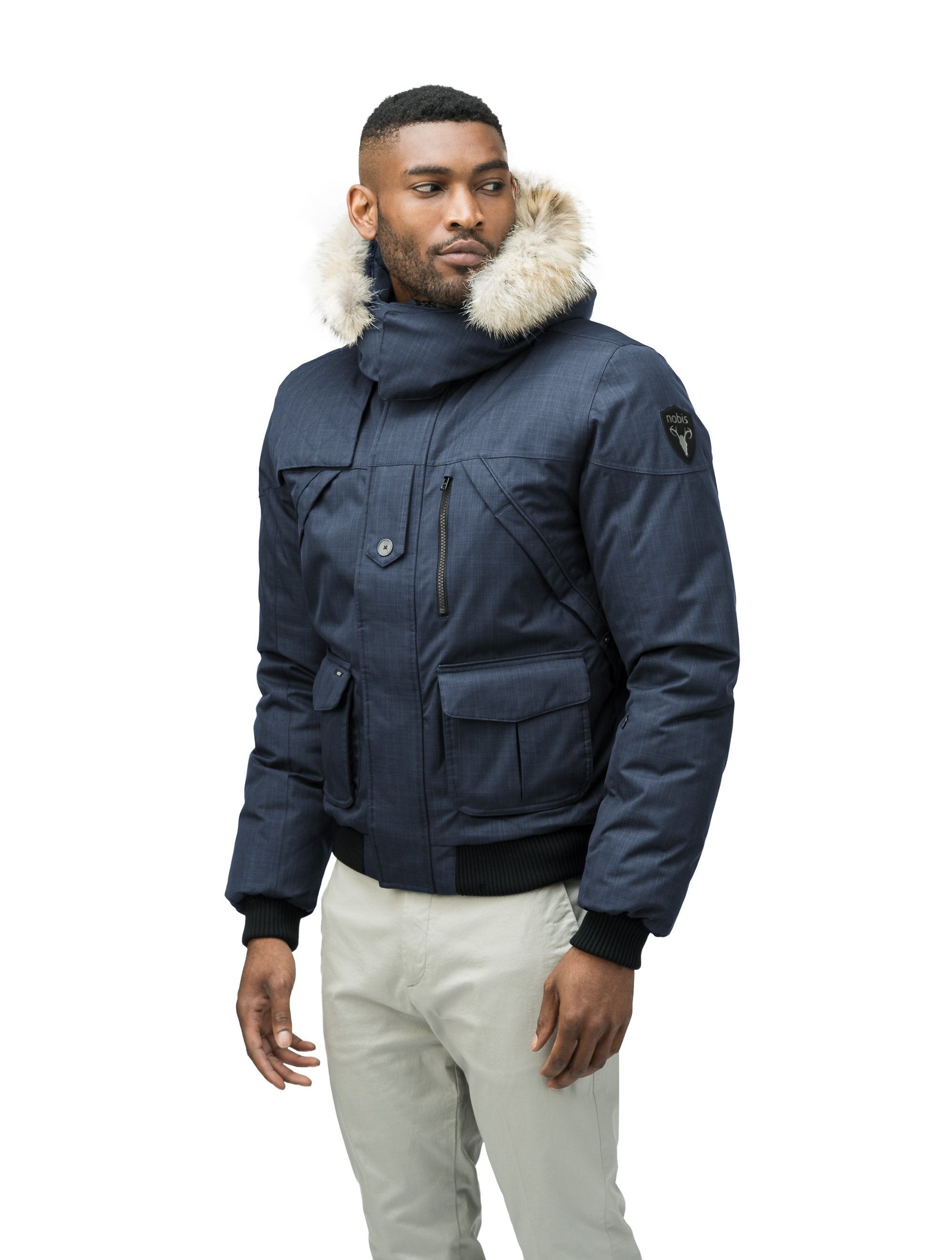 Men's classic down bomber with two patch pockets and a right shoulder storm flap in H. Navy