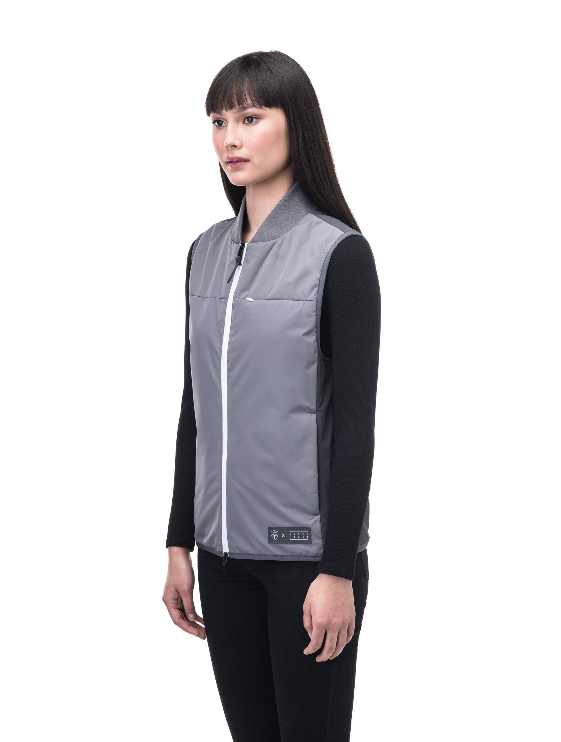 Unisex hip length vest with a contrast colour back panel, and hidden zipper pockets at waist, and an invisible zipper pocket at chest, in Concrete/Steel Grey