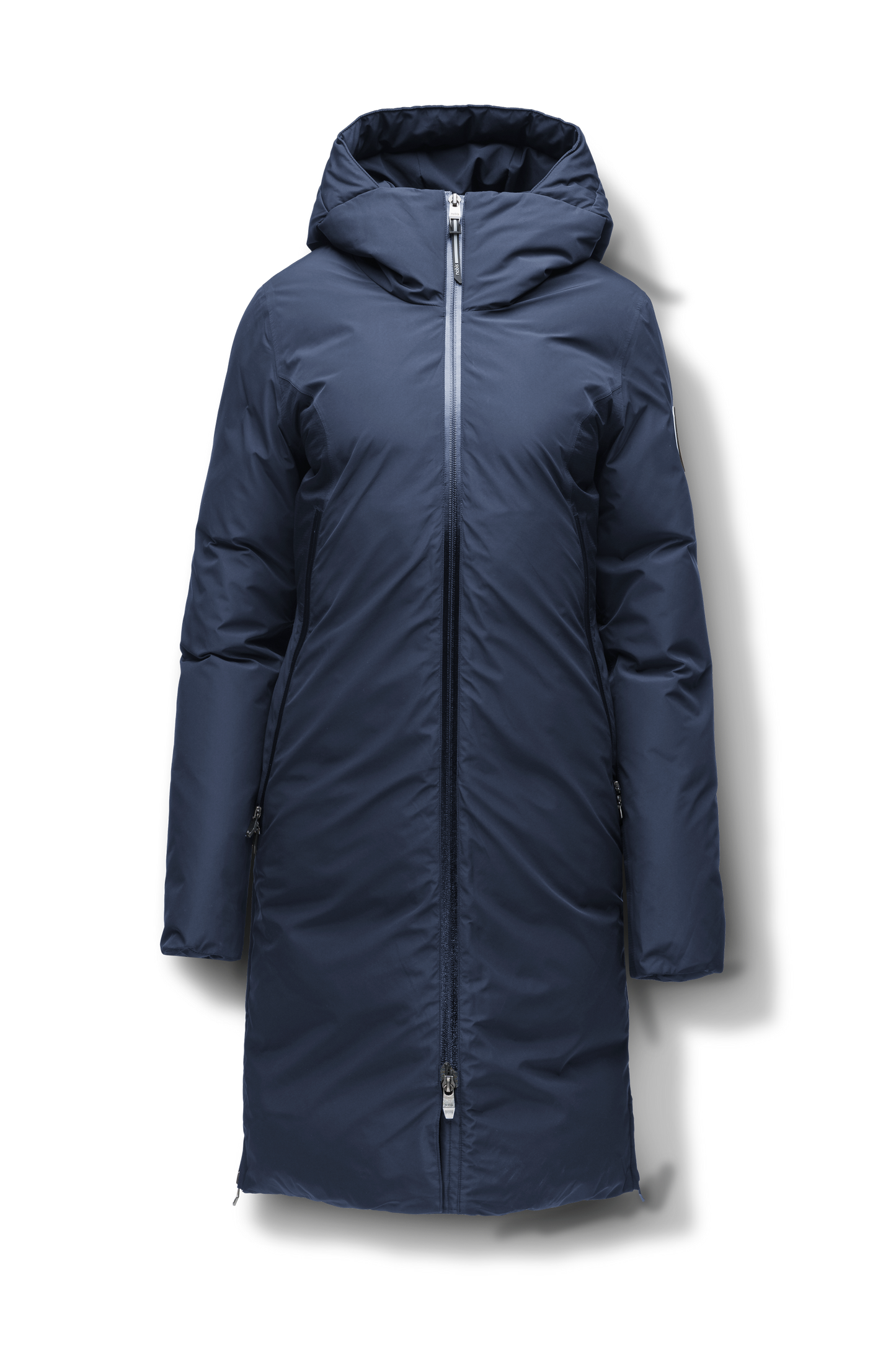 Inara Women's Performance Parka in knee length, premium 3-ply micro denier and stretch ripstop fabrication with DWR coating, Premium Canadian White Duck Down insulation, non-removable down-filled hood, centre front two-way zipper, large vertical zipper pockets along waist, zipper vents along bottom side hem, in Marine