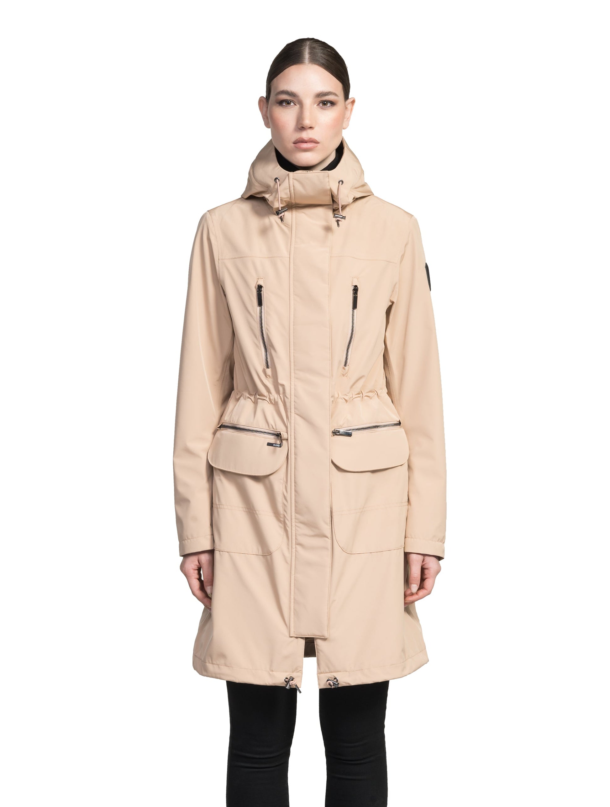 Women's knee length anorak with four front pockets and adjustable cord waist in Fawn