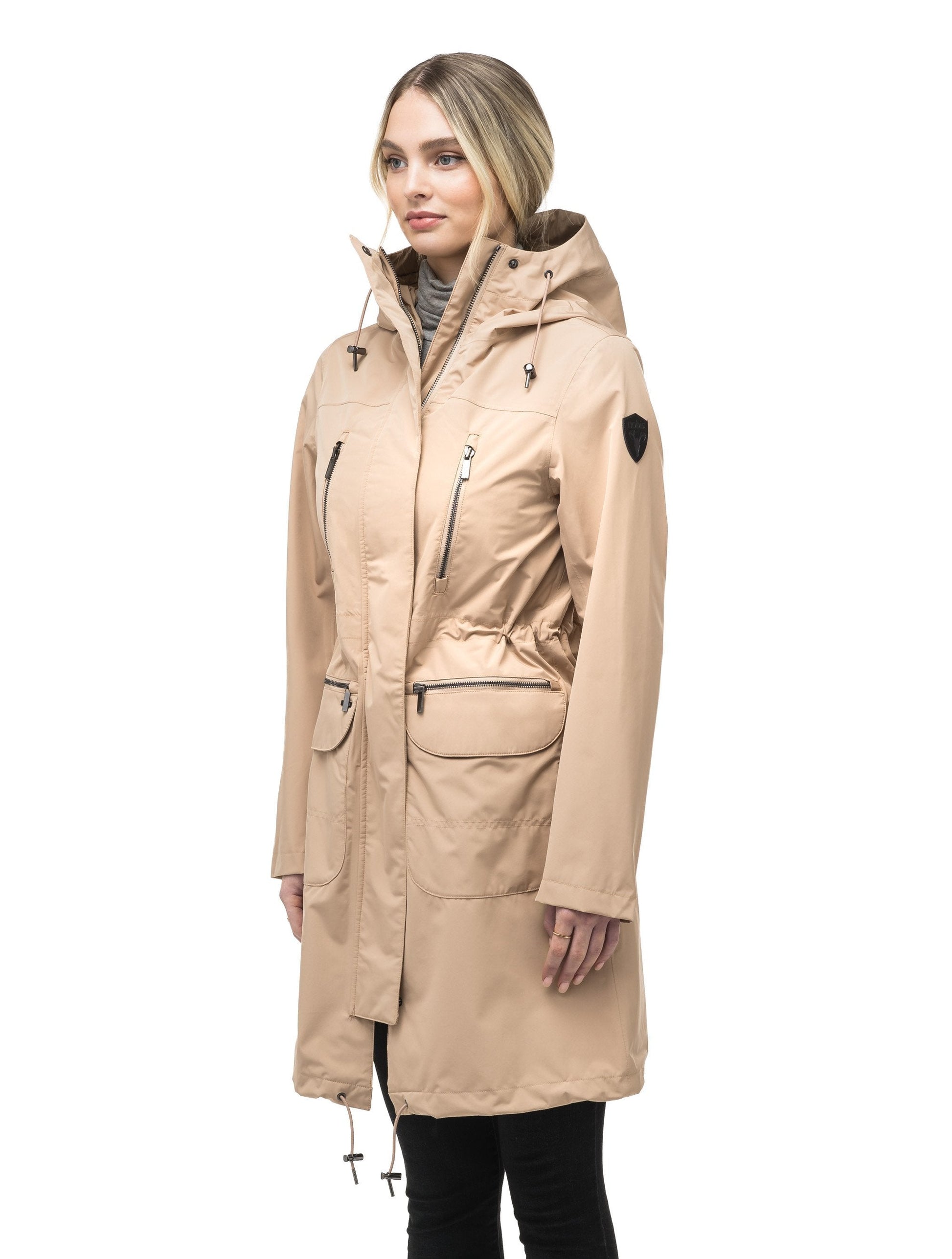 Women's knee length anorak with four front pockets and adjustable cord waist in Fawn