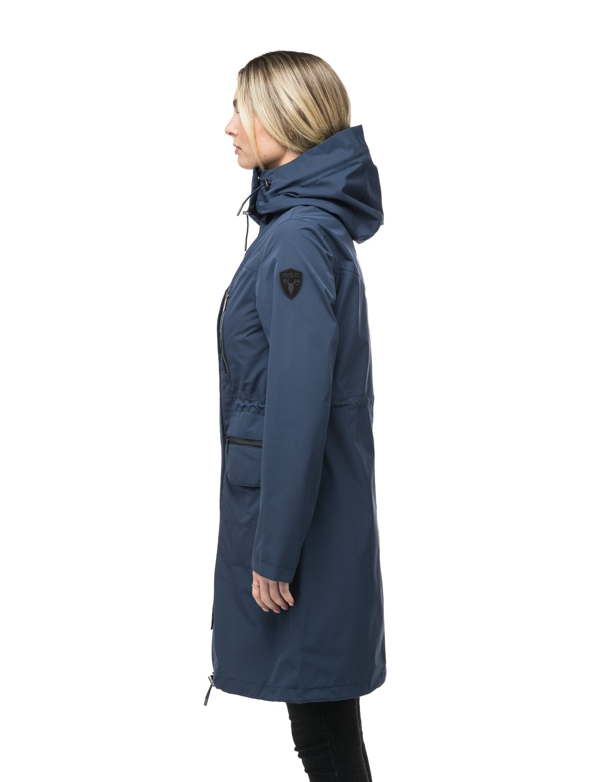 Women's knee length anorak with four front pockets and adjustable cord waist in Marine