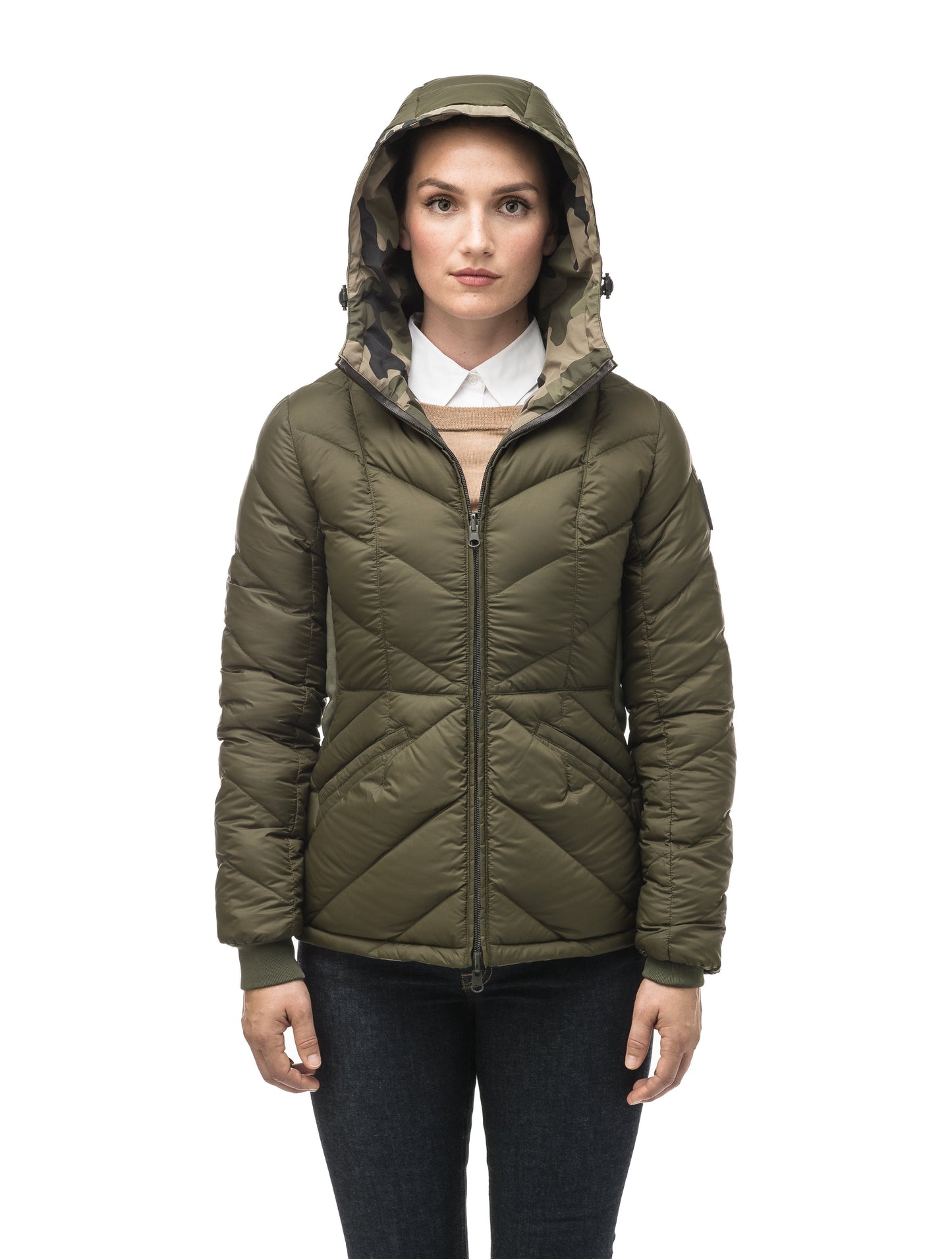 A women's two in one reversible hip length down jacket, one side is quilted and one side is solid waterproof fabric in Camo
