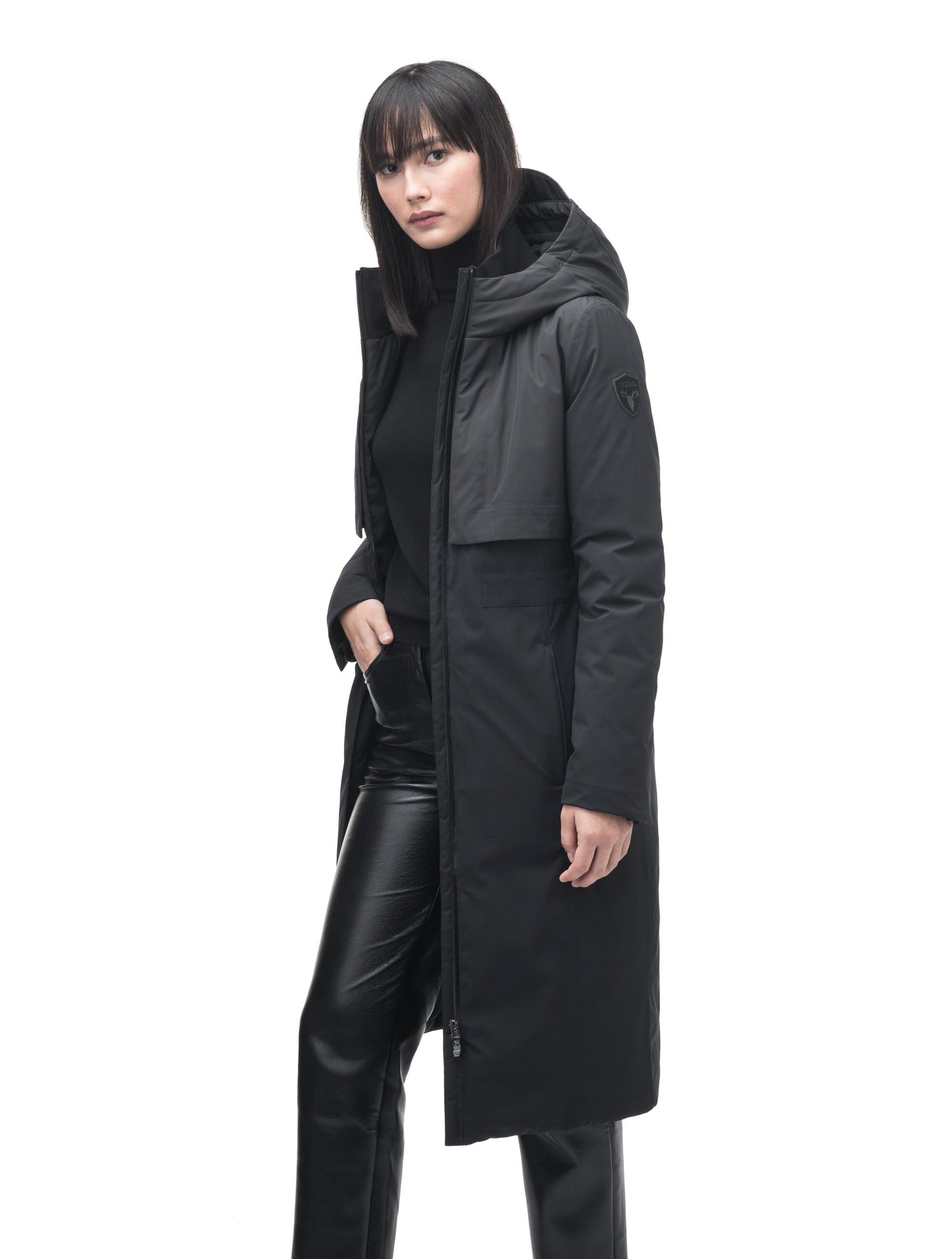 Iris Ladies Long Parka in below the knee length, Canadian duck down insulation, non-removable hood, and two-way zipper, in Black