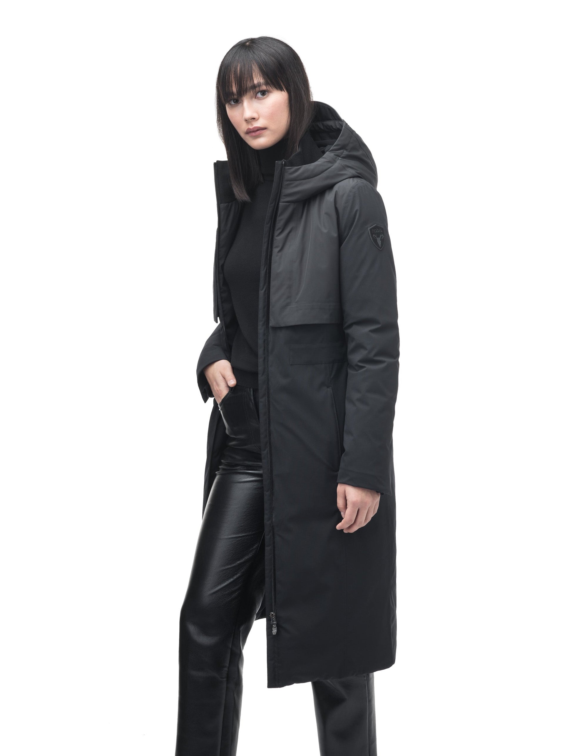 Iris Ladies Long Parka in below the knee length, Canadian duck down insulation, non-removable hood, and two-way zipper, in Black