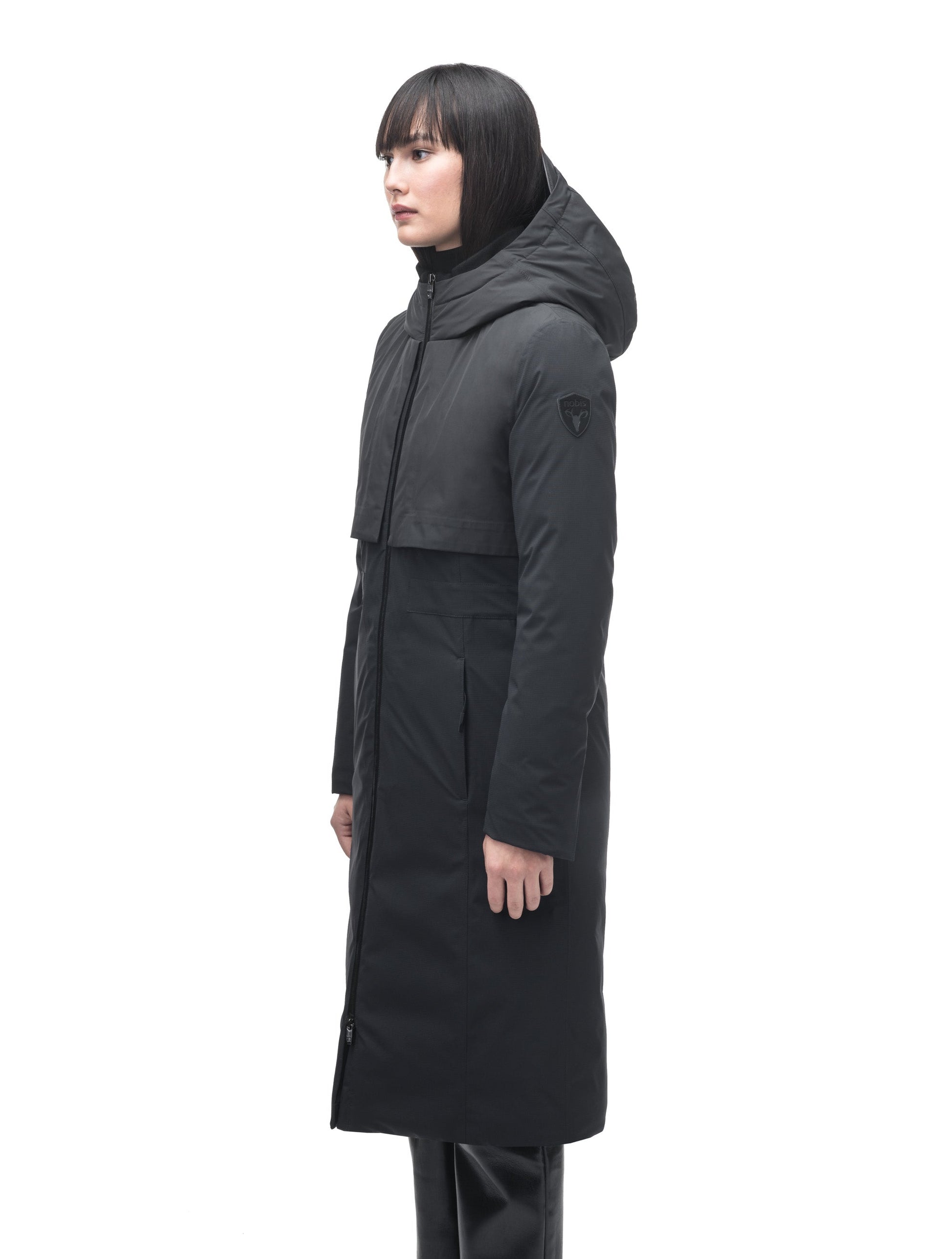 Iris Ladies Long Parka in below the knee length, Canadian duck down insulation, non-removable hood, and two-way zipper, in Black