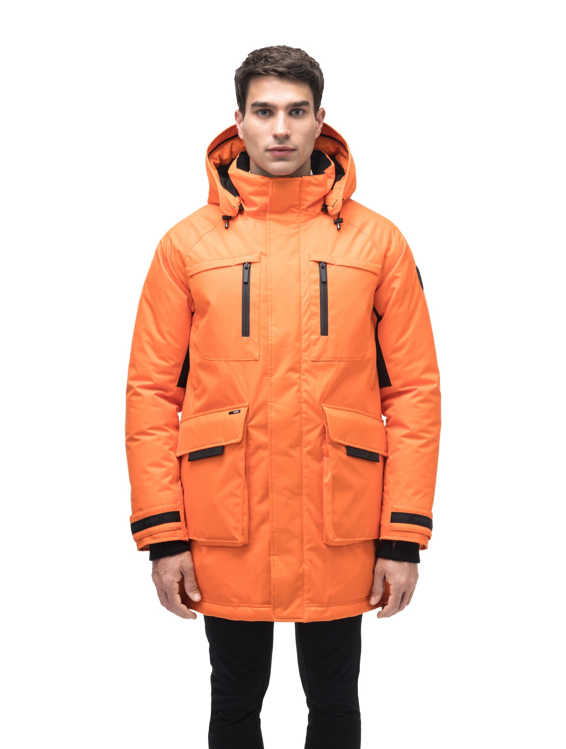 Men's thigh length down-filled parka with removable hood and removable coyote fur trim in Atomic